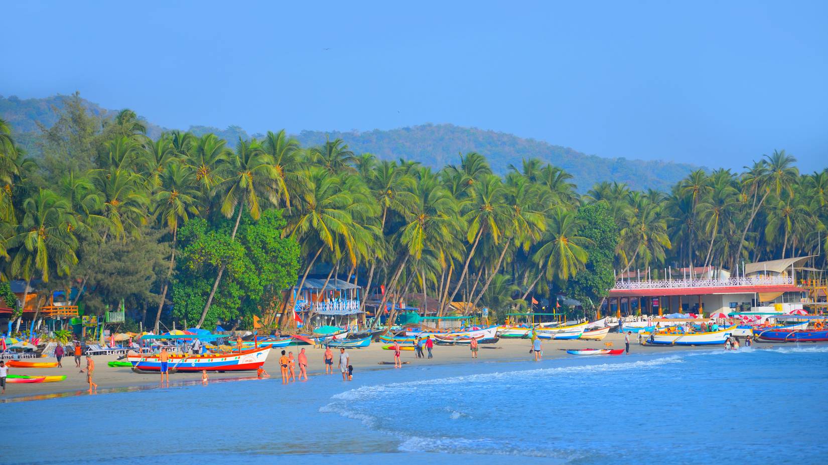 Tourists enjoying themselves at Palolem Beach in Goa, India