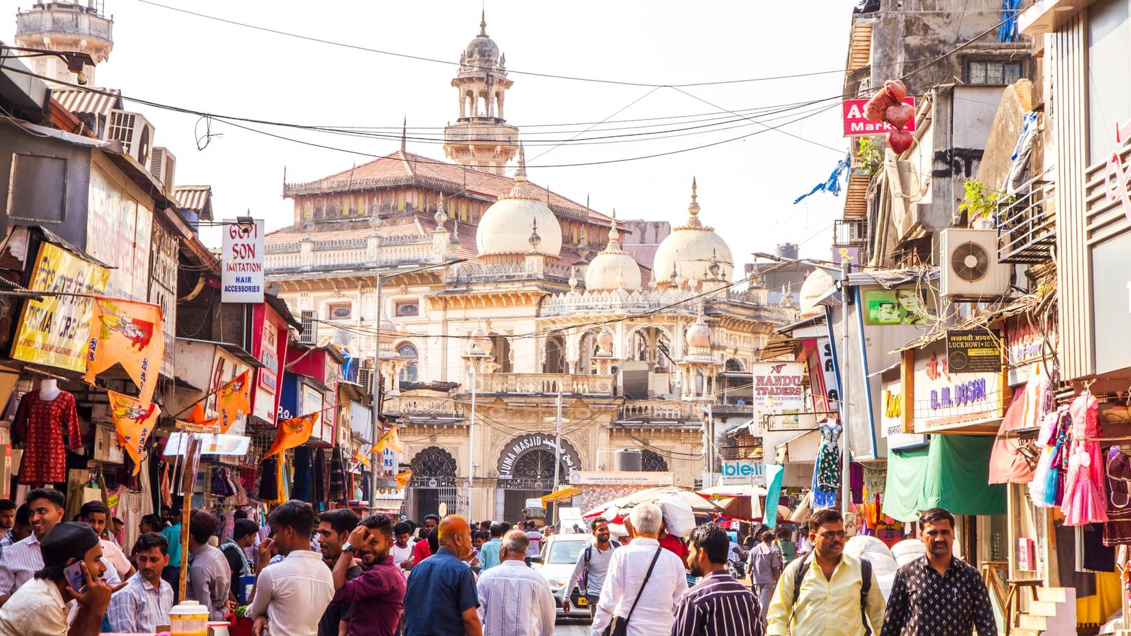 Crowd on the street of Crawford Market, a popular tourist stop, in front of Juma Masjid in Mumbai, Maharashtra, India