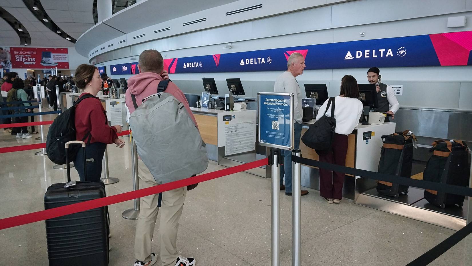 Delta Air Lines counter as passengers face flight suspension. 