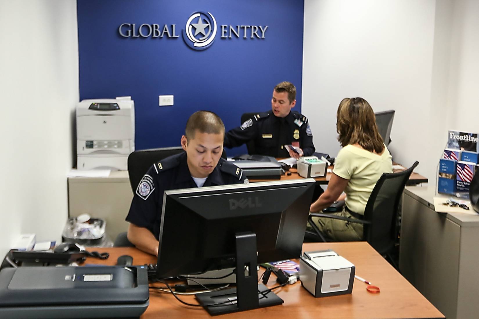 U.S. Customs and Border Protection (CBP) officers at a Global Entry Enrollment Center