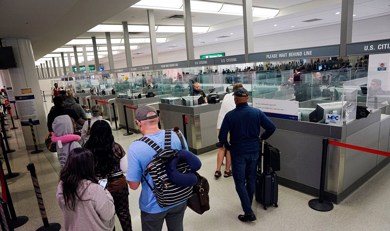 International travelers waiting in line at a U.S. Customs and Border Protection (CBP) checkpoint at a U.S. airport
