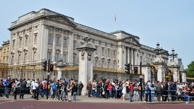A crowd waiting in front of Buckingham Palace in London, UK