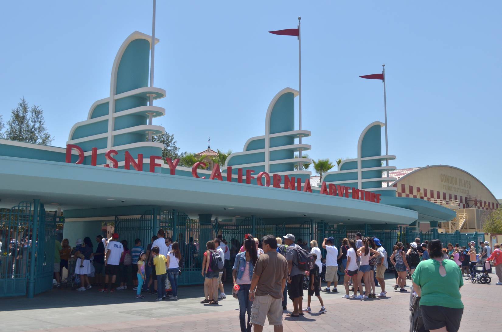 Groups of people line up at the entrance to Disney California Adventure