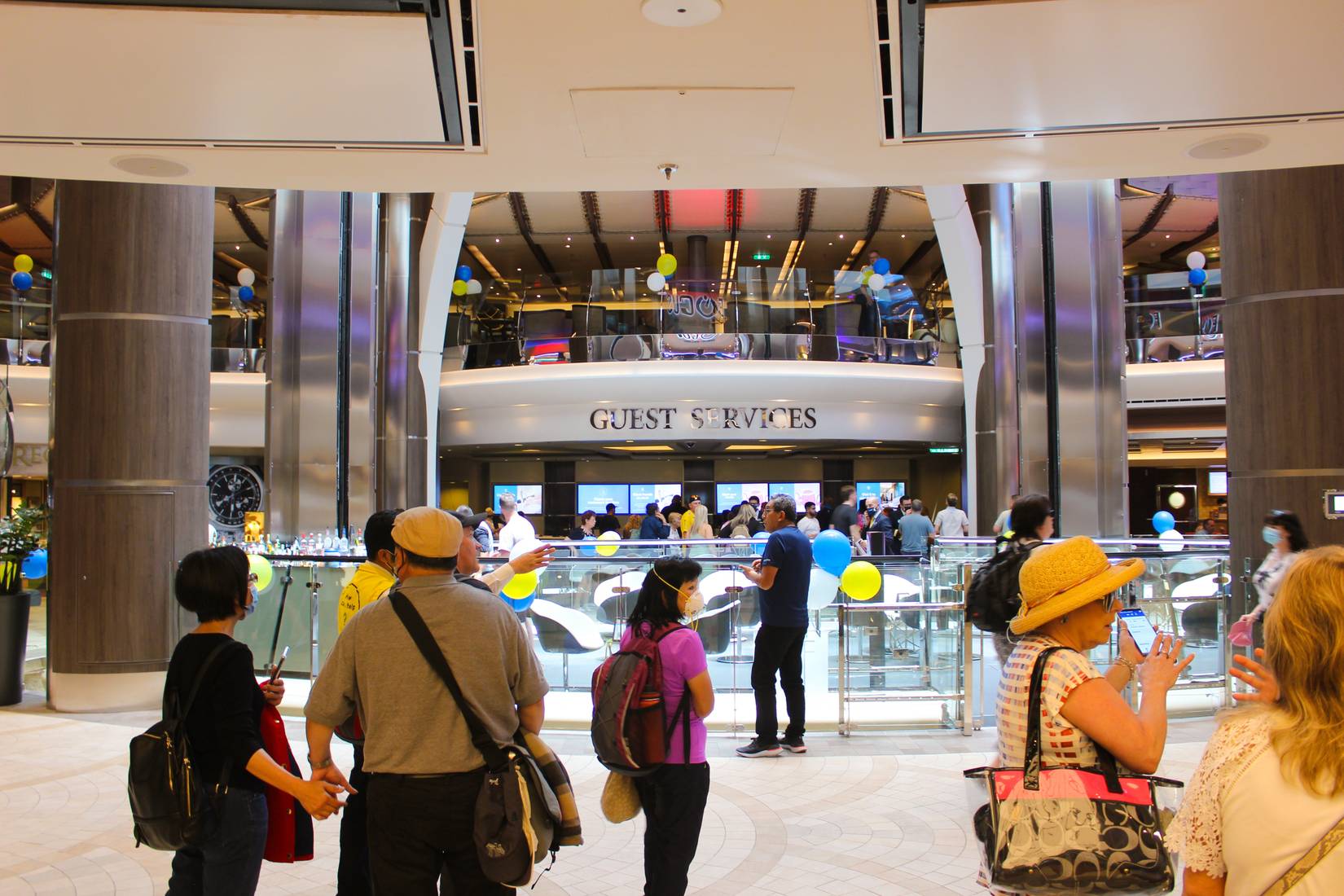 Royal Caribbean passengers at Promenade on the Symphony of the Seas cruise ship