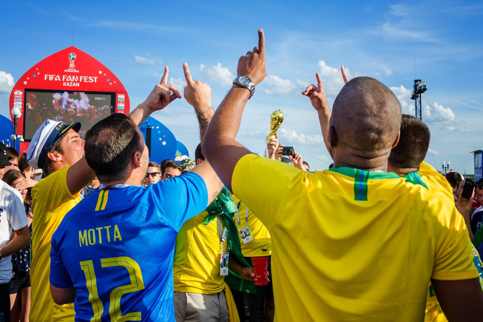 Brazilian football fans cheer for their team in the Kazan fan zone during the 2018 FIFA world Cup in Russia