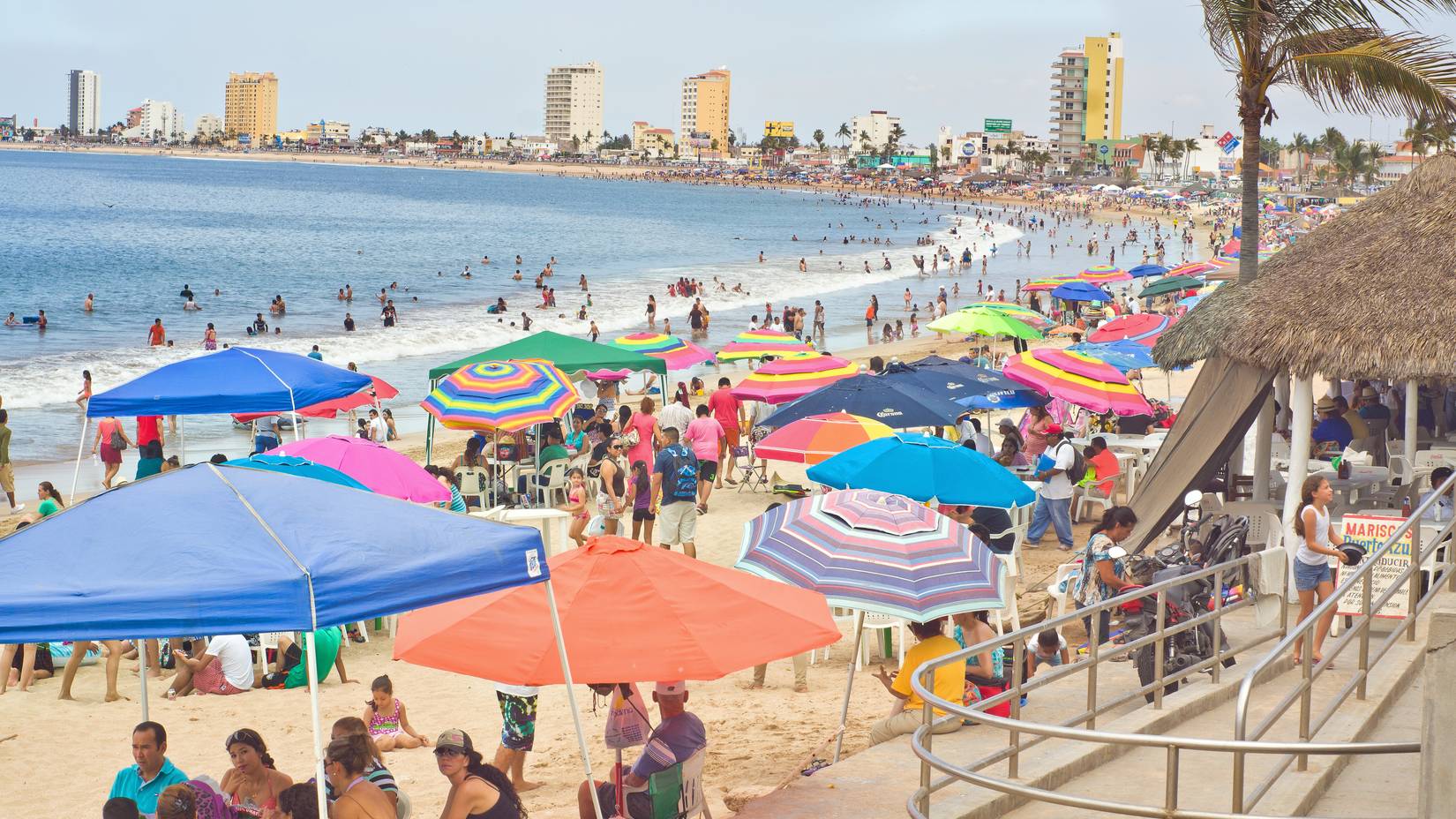 Hundreds of thousands of tourists flock to the beaches in Mazatlan, Mexico