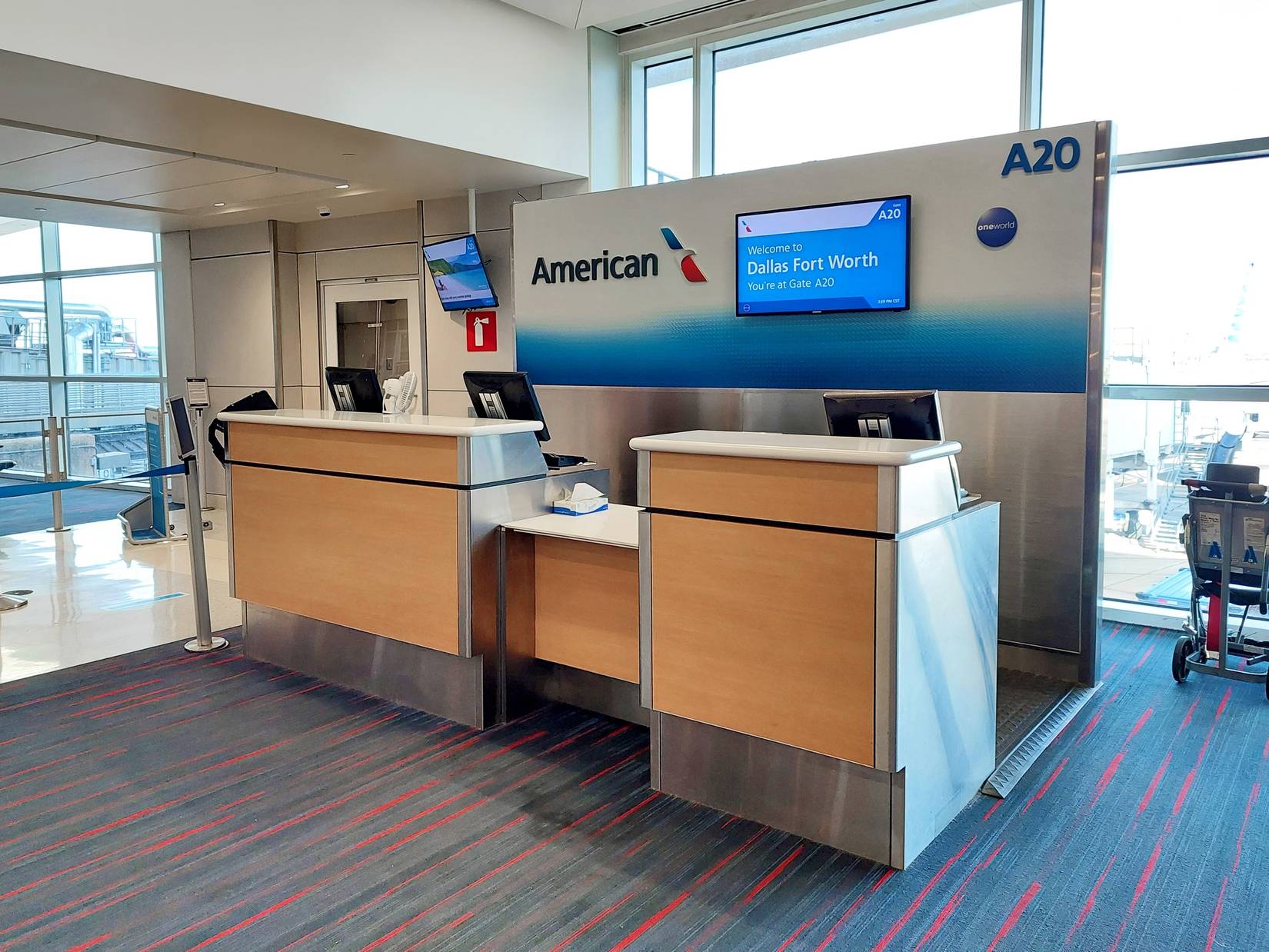 Empty American Airlines counter at DFW following cancellations.