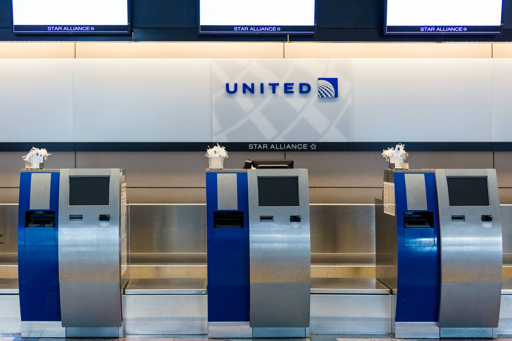 Denver International Airport with an empty United Airlines check-in counter