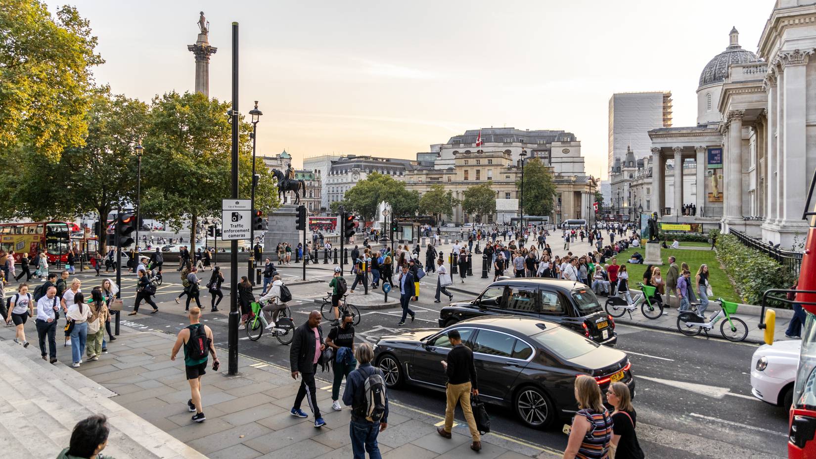 Bustling Trafalgar Square in London, UK