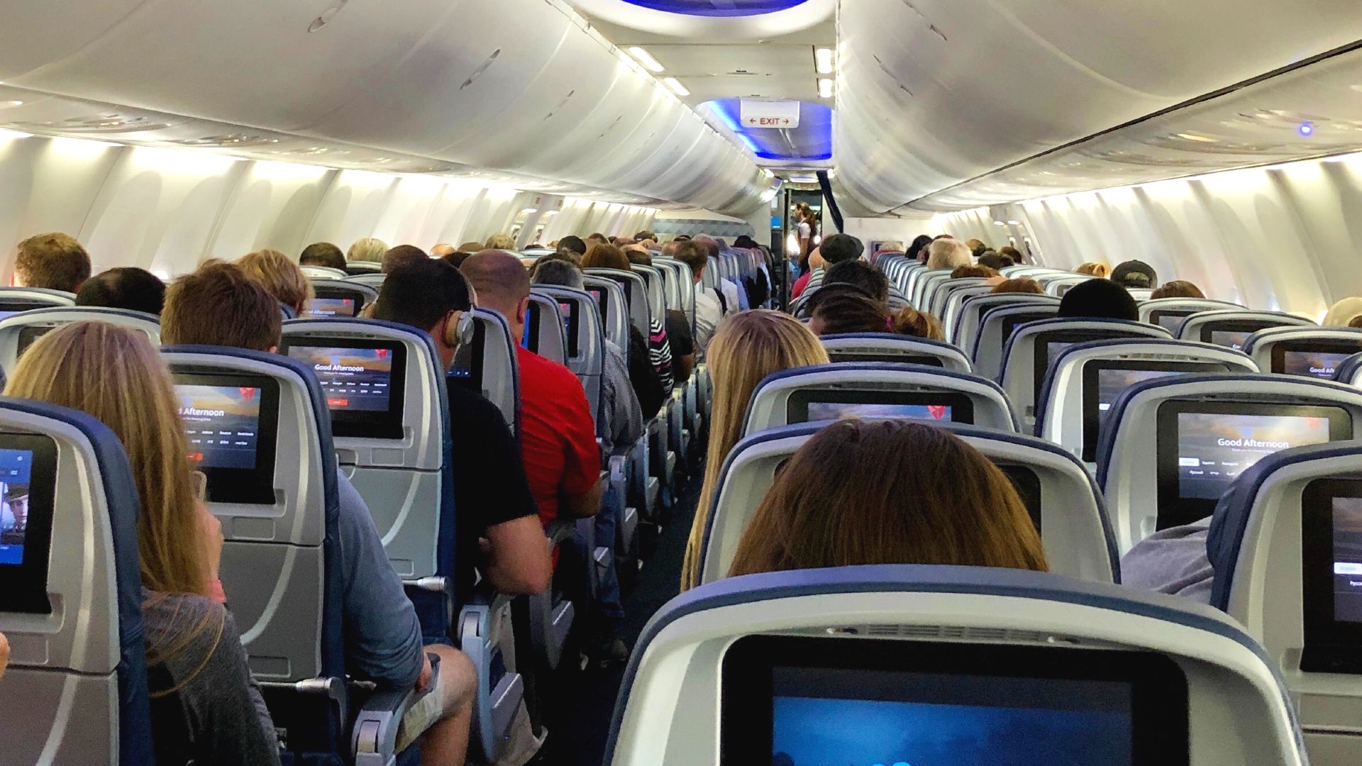 Delta Air Lines aircraft interior full of passengers