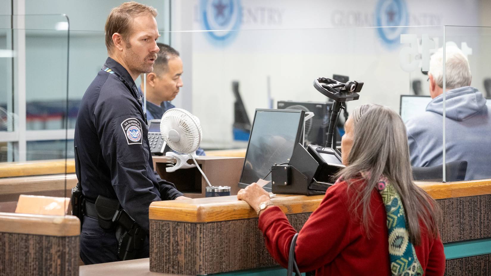 U.S. Customs and Border Protection officer processes arriving international passenger at Phoenix Sky Harbor International Airport (PHX), Arizona