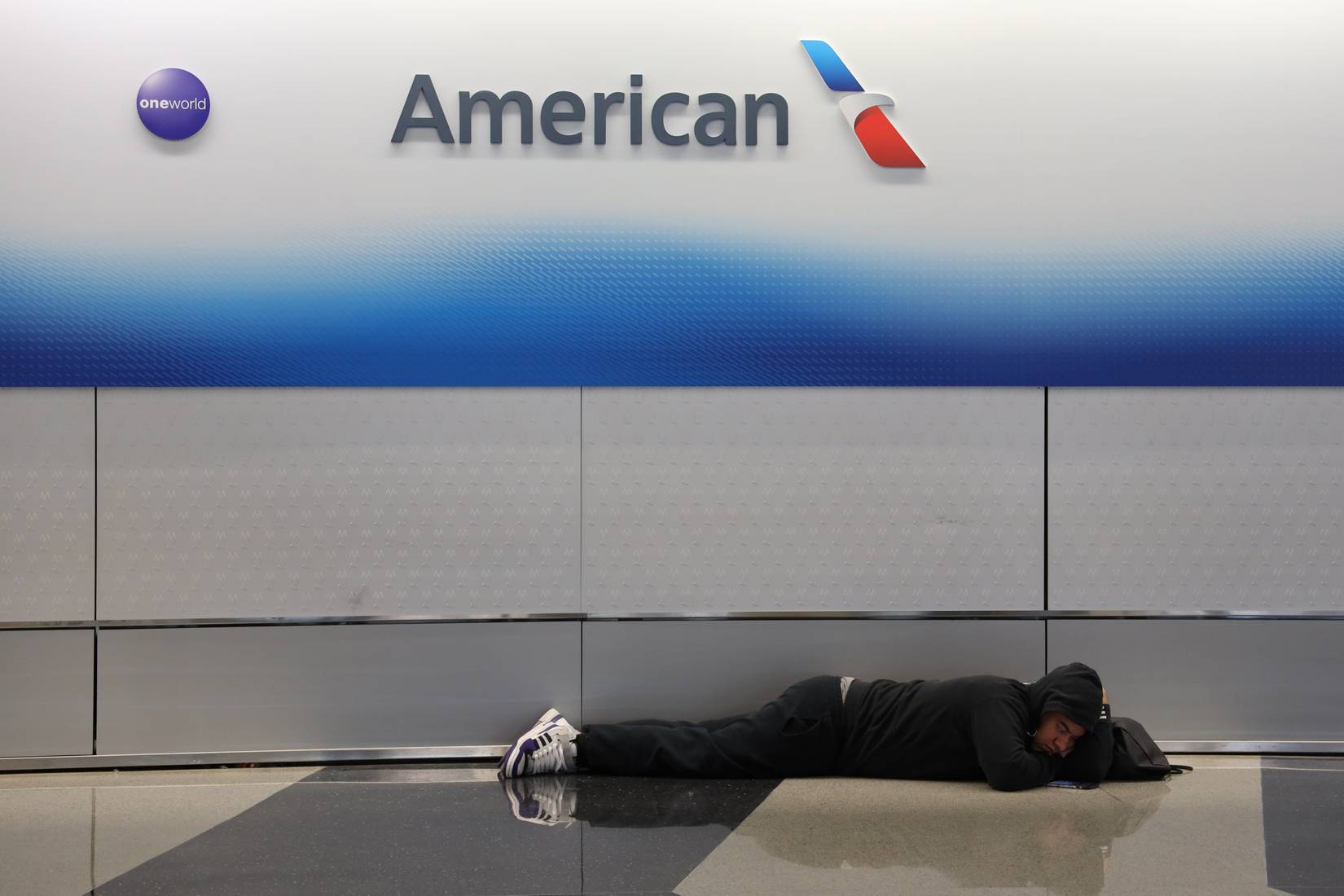 ORD passenger stranded and sleeping.