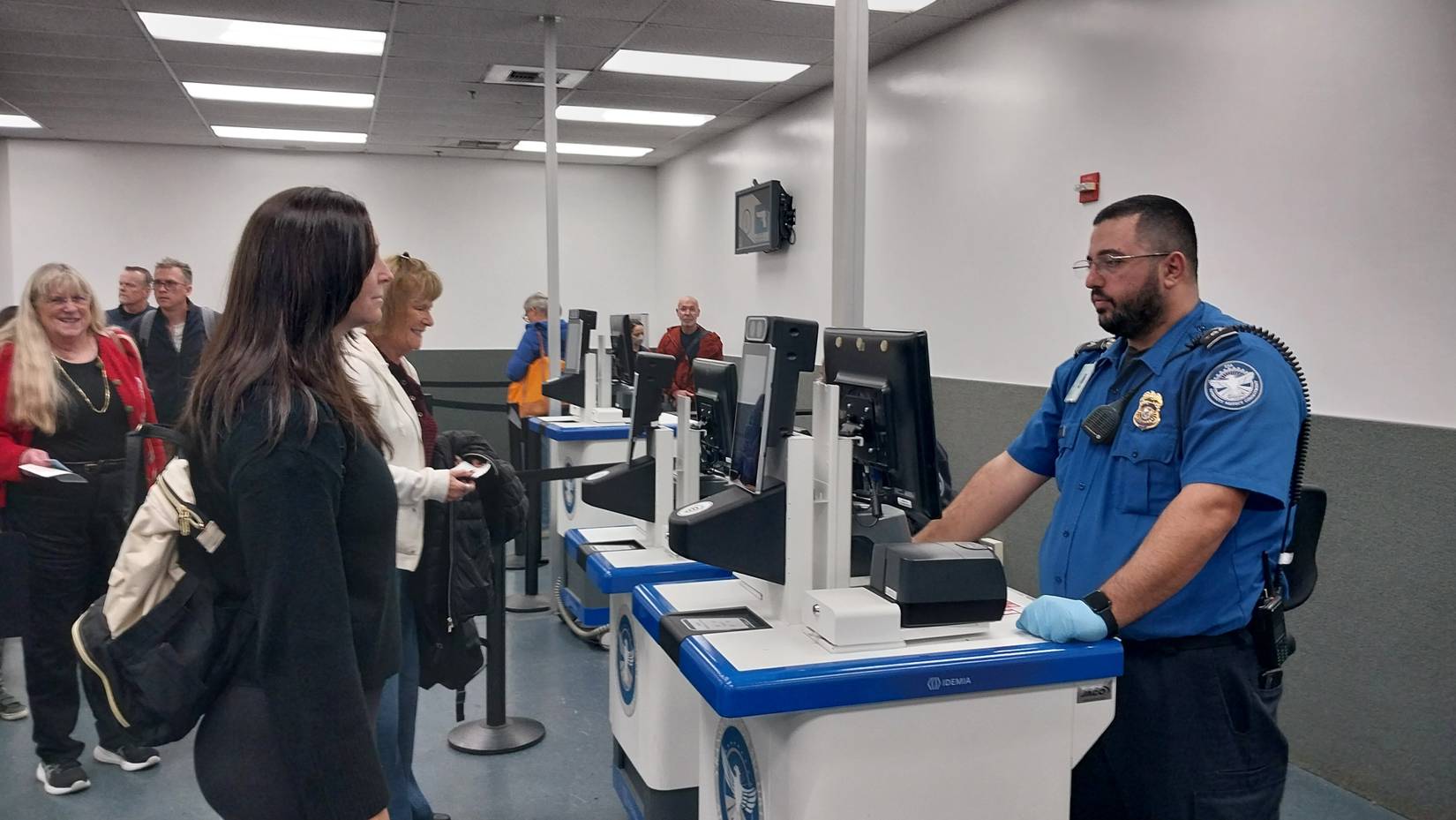 Travelers in line at a Transportation Security Administration (TSA) checkpoint at a U.S. airport