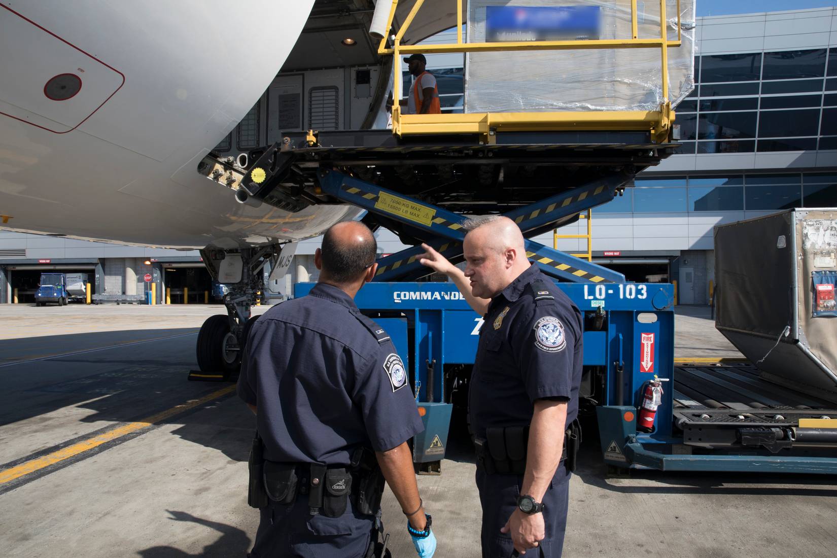 U.S. Customs and Border Protection (CBP) officers searching an aircraft at a US airport