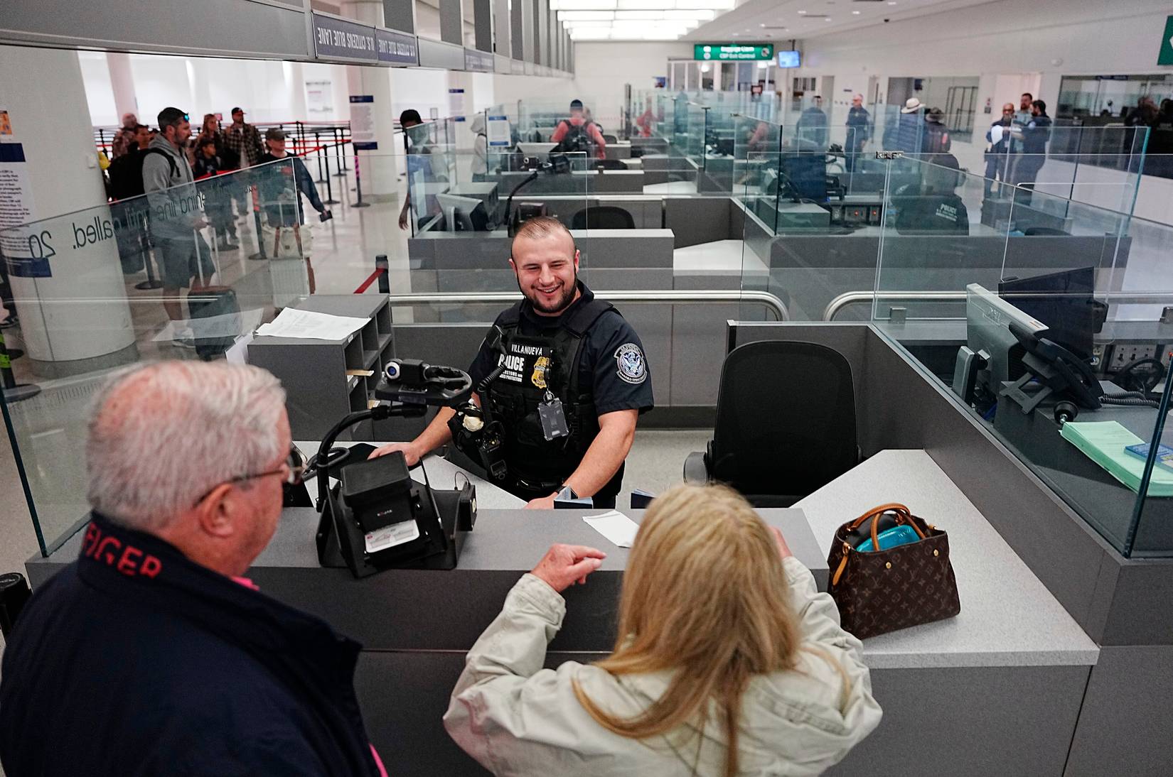 CBP officer processing travelers 