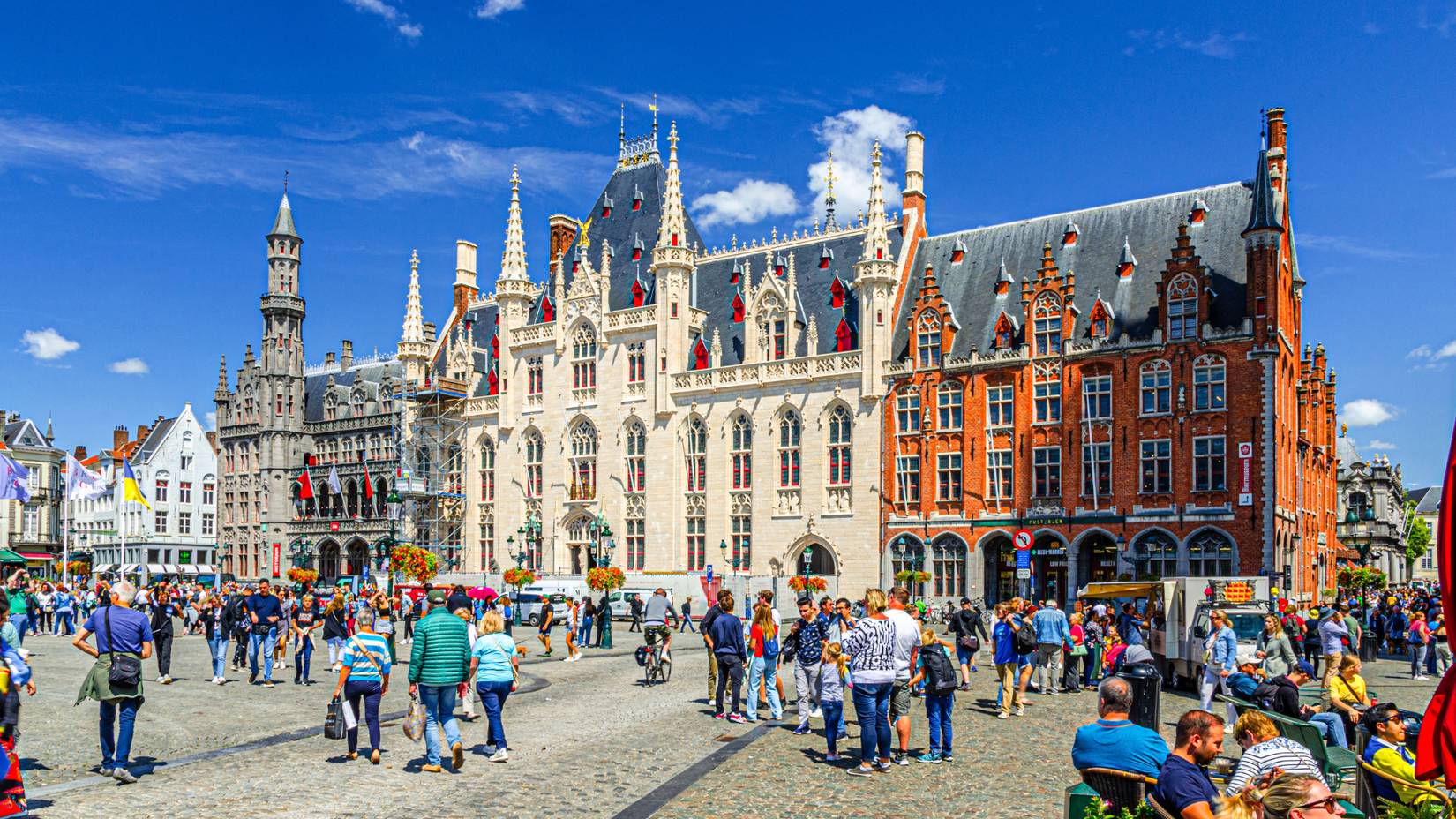 Tourists walking down Markt square in Bruges, Belgium
