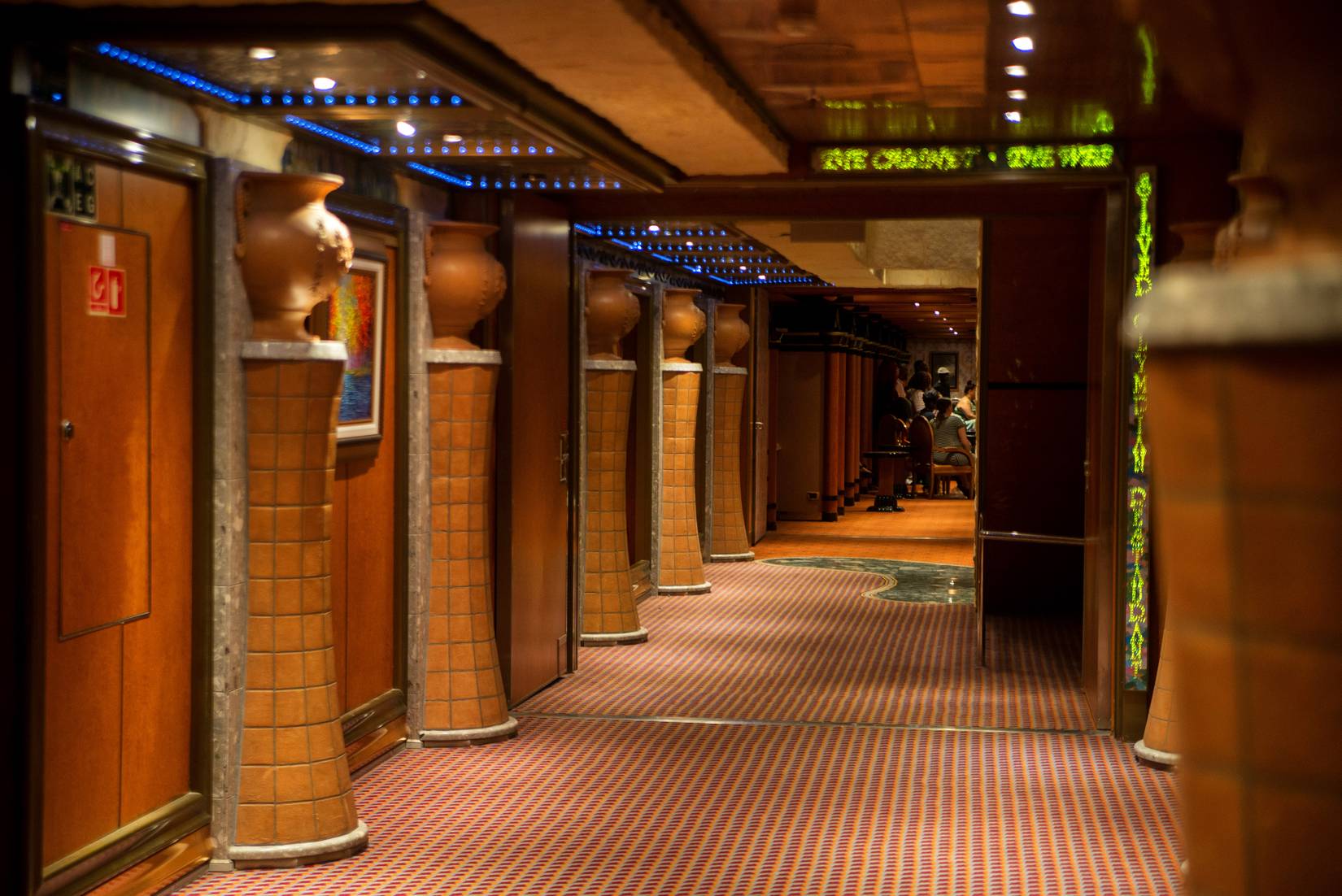 Cruise ship interior with colorful fixtures, lamps, staircases, hallways and lounges. Carnival Cruise Line, Carnival Glory. 