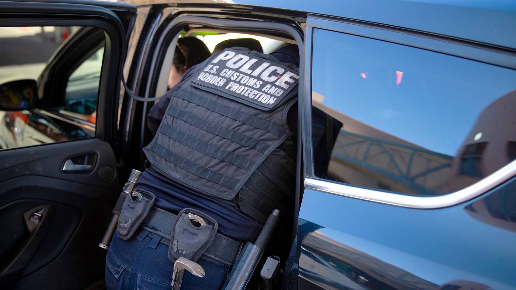 Customs Border Protection, inspect a car