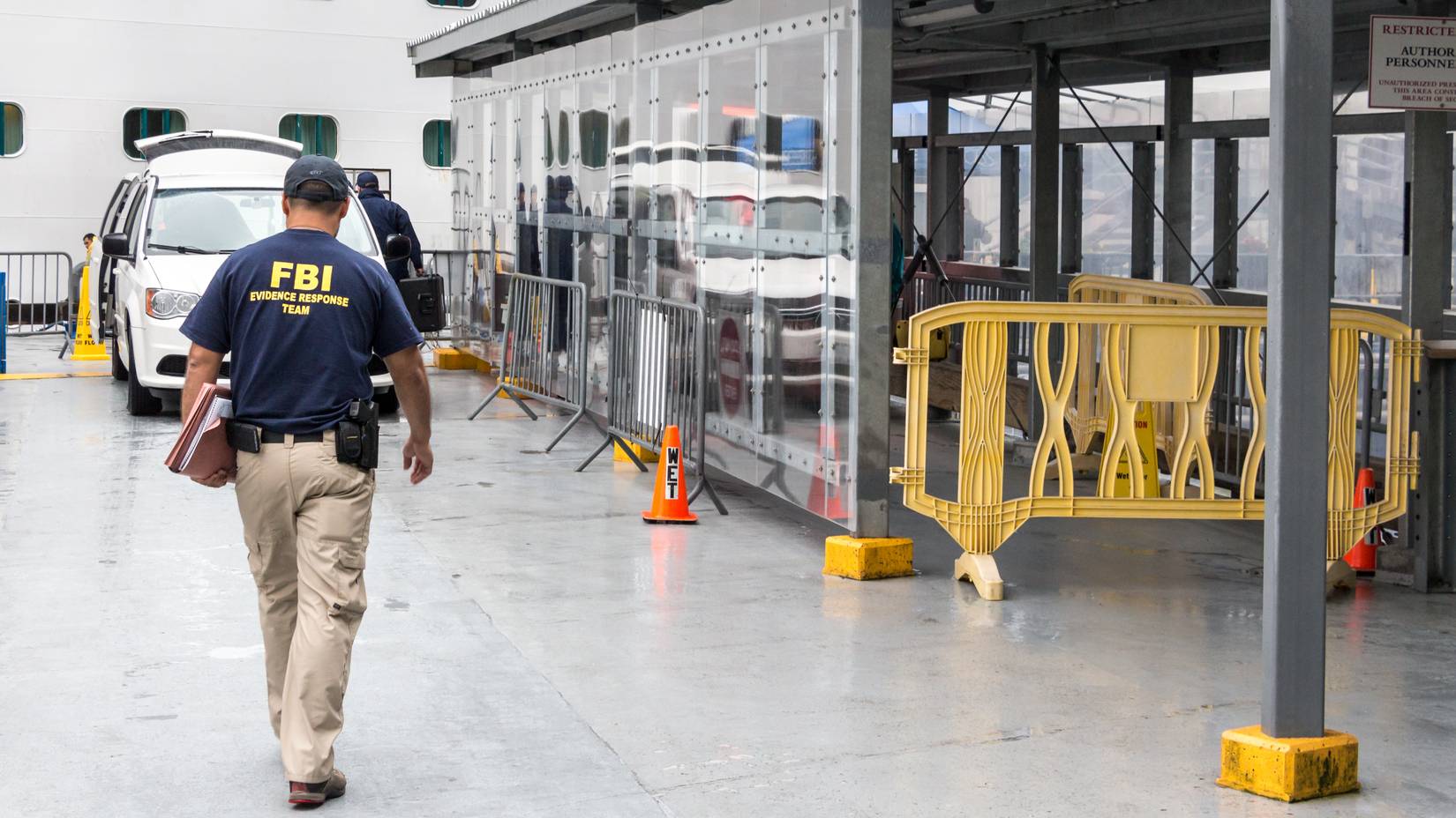 FBI officer going inside the Emerald Princess Cruise Ship docked in Juneau to investigate a crime