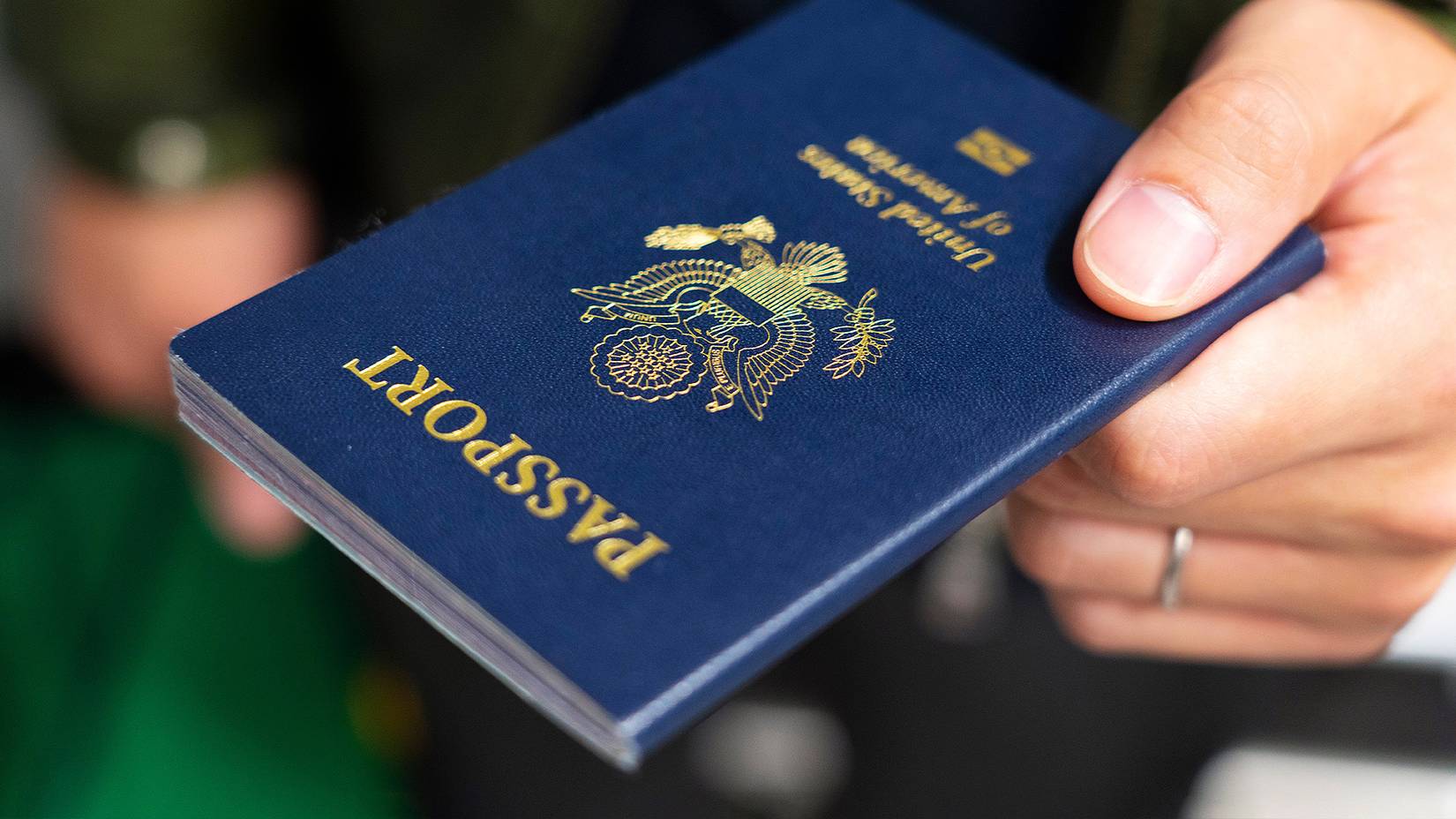 Handing over US passport in an airport