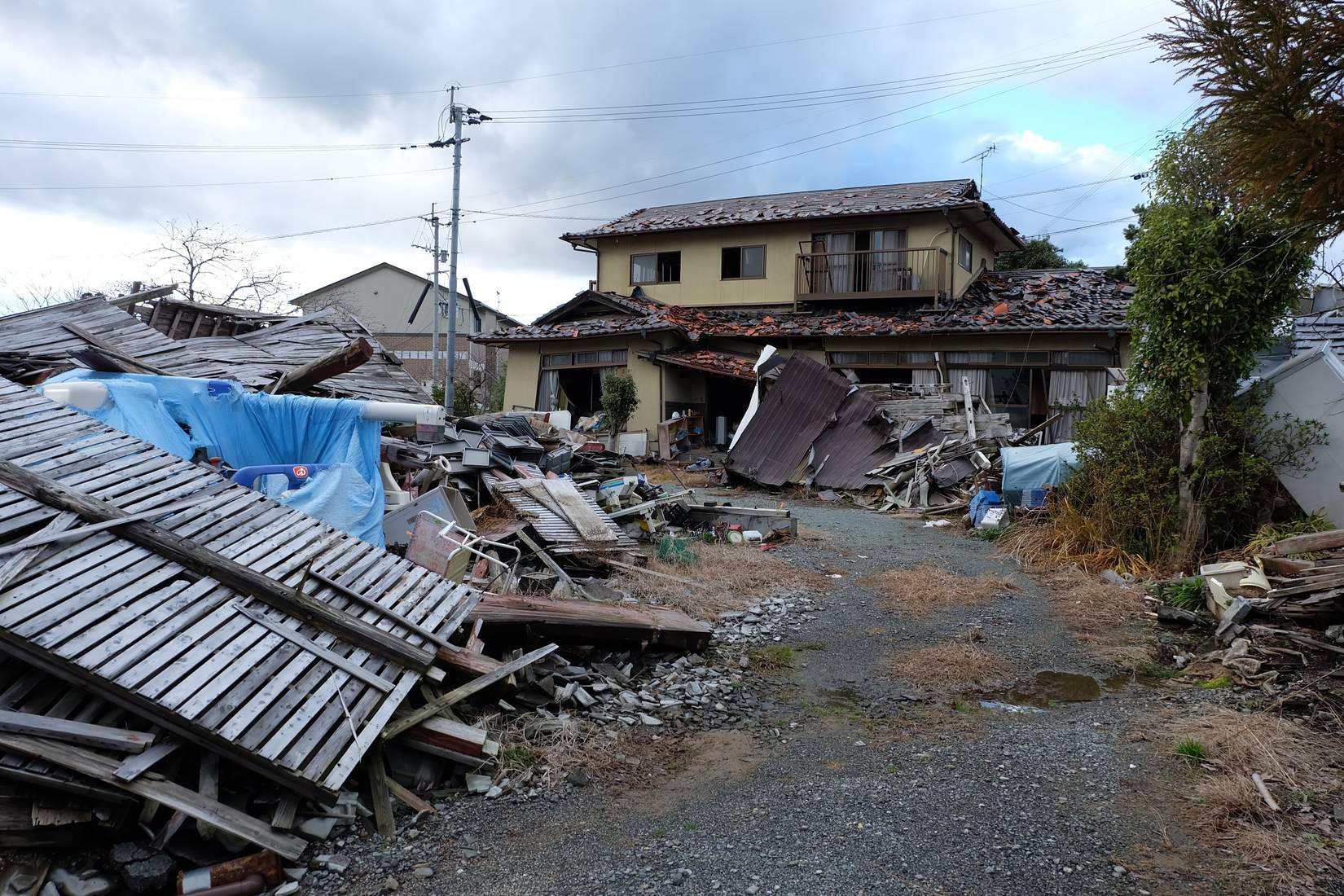 Damaged and collapsed buildings along a street after the Kumamoto earthquake in April 2016
