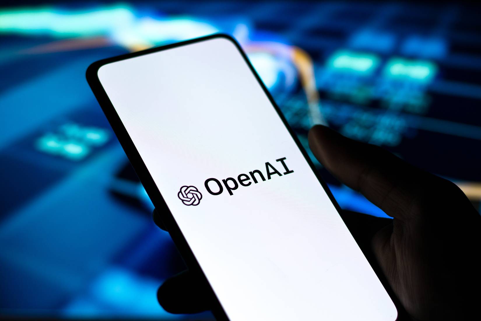 OpenAI logo on phone screen