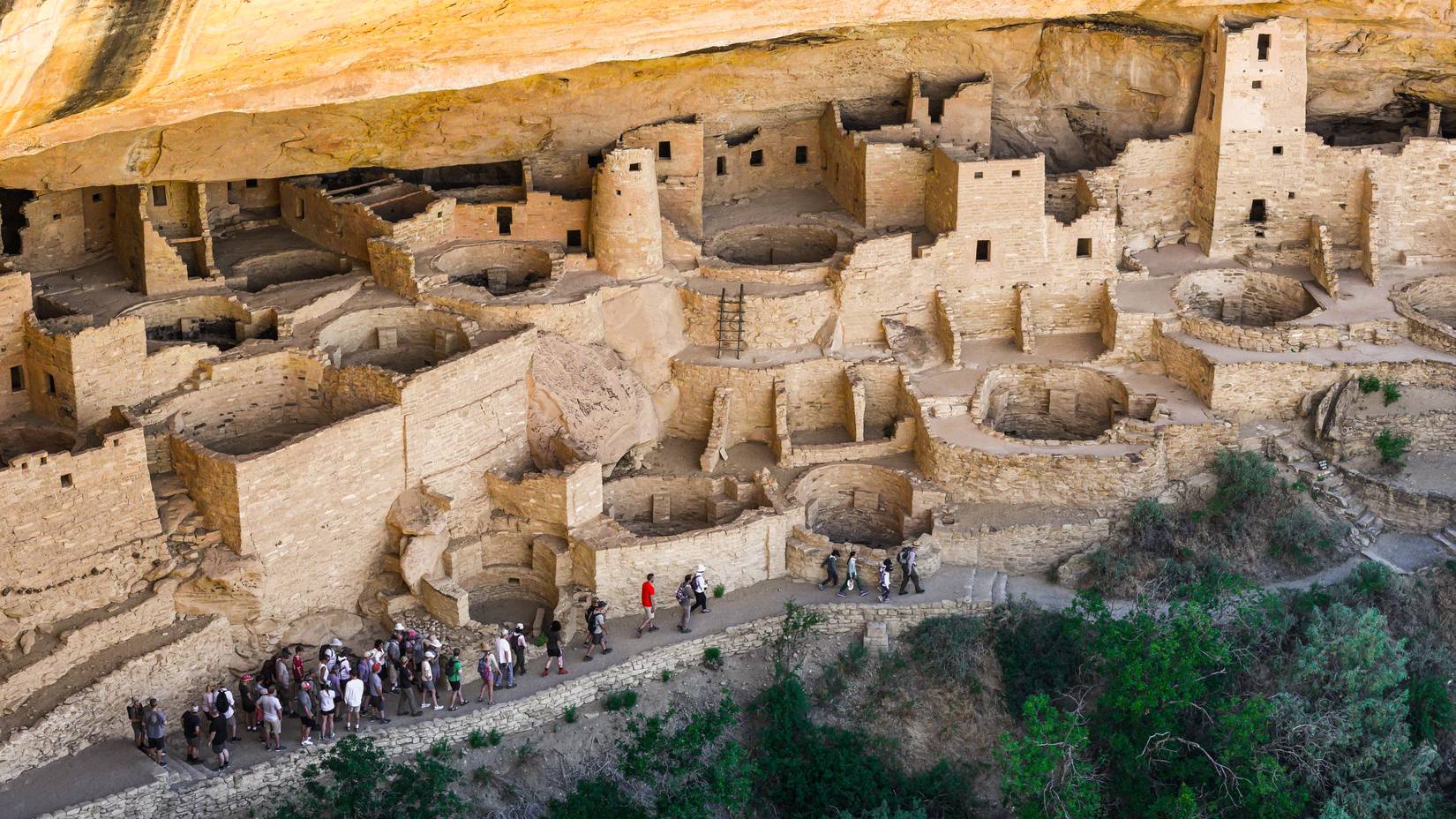 Organized tour group at Cliff Palace dwelling at Mesa Verde National Park, CO