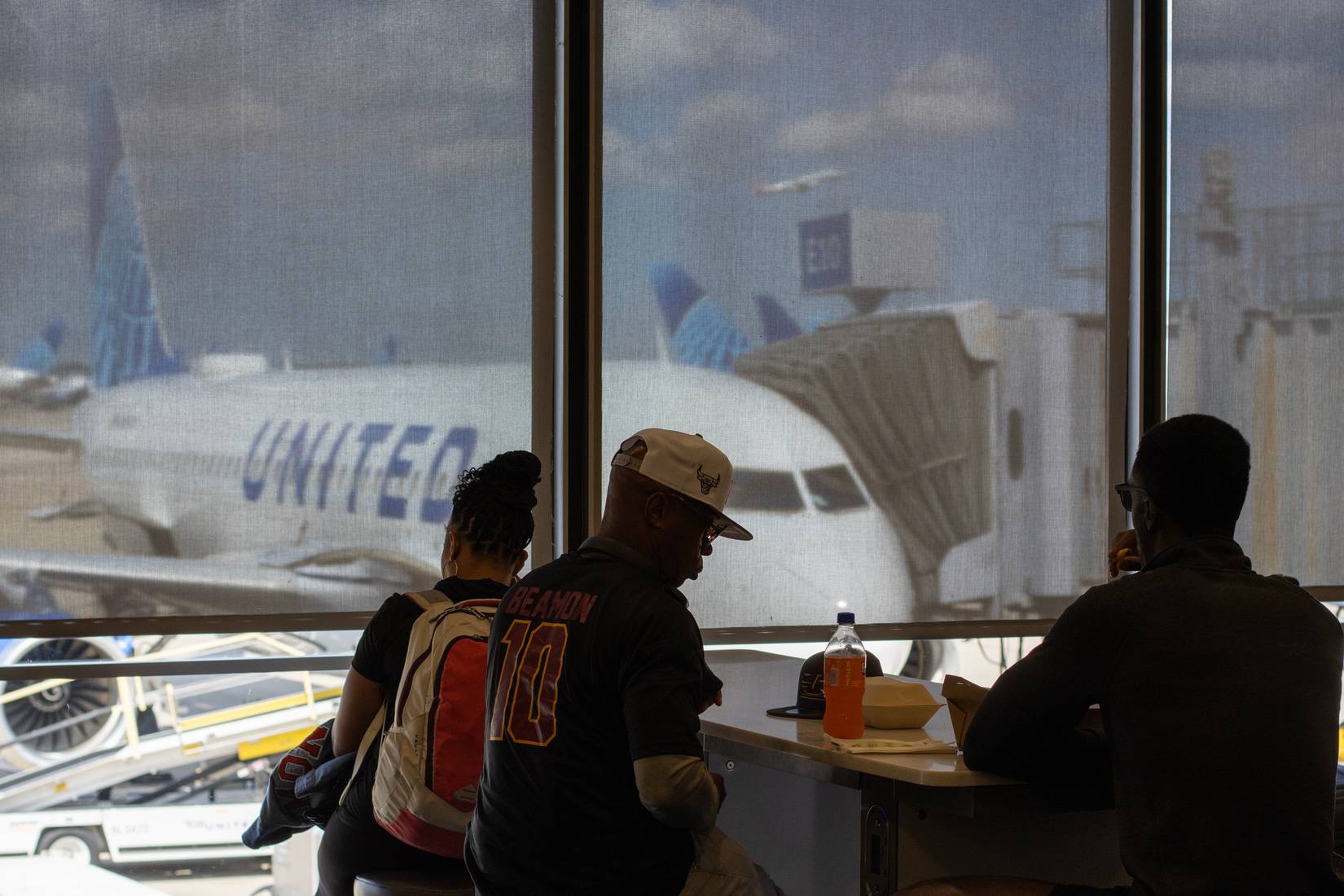 Passengers at a United Airlines gate at Chicago O'Hare International Airport (ORD, USA