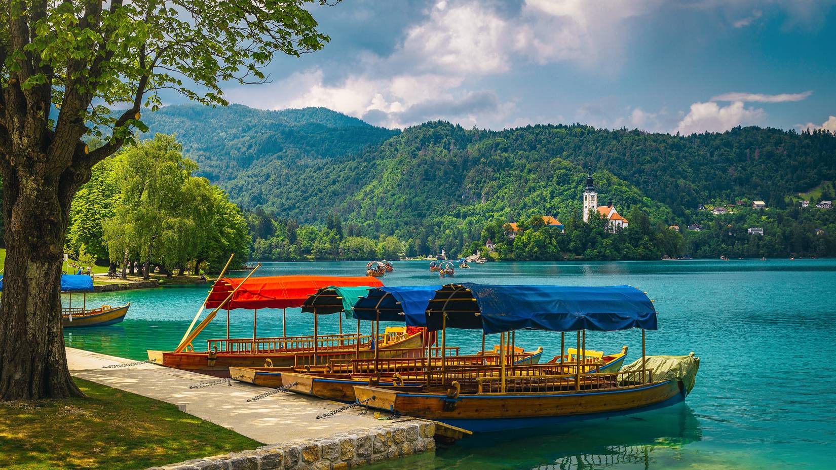 Pletna boats anchored on the Lake Bled ,on the small island, Bled, Slovenia