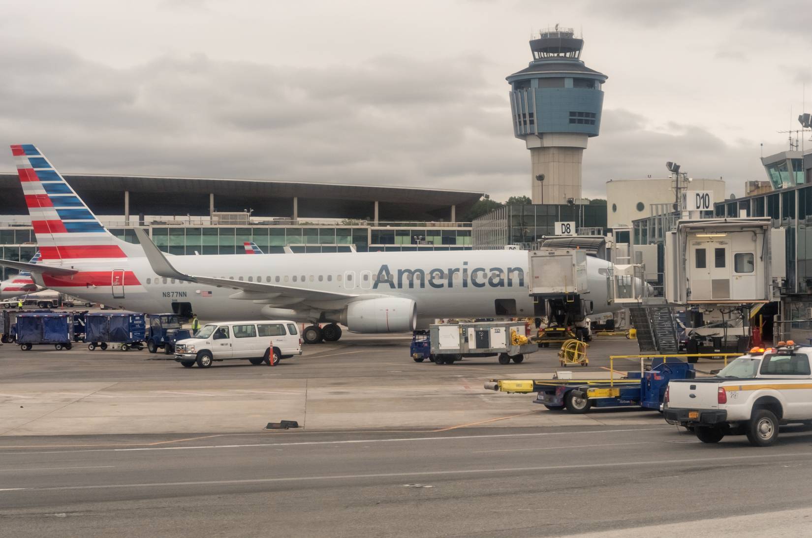 American airlines plane parked at LGA on a cloudy day