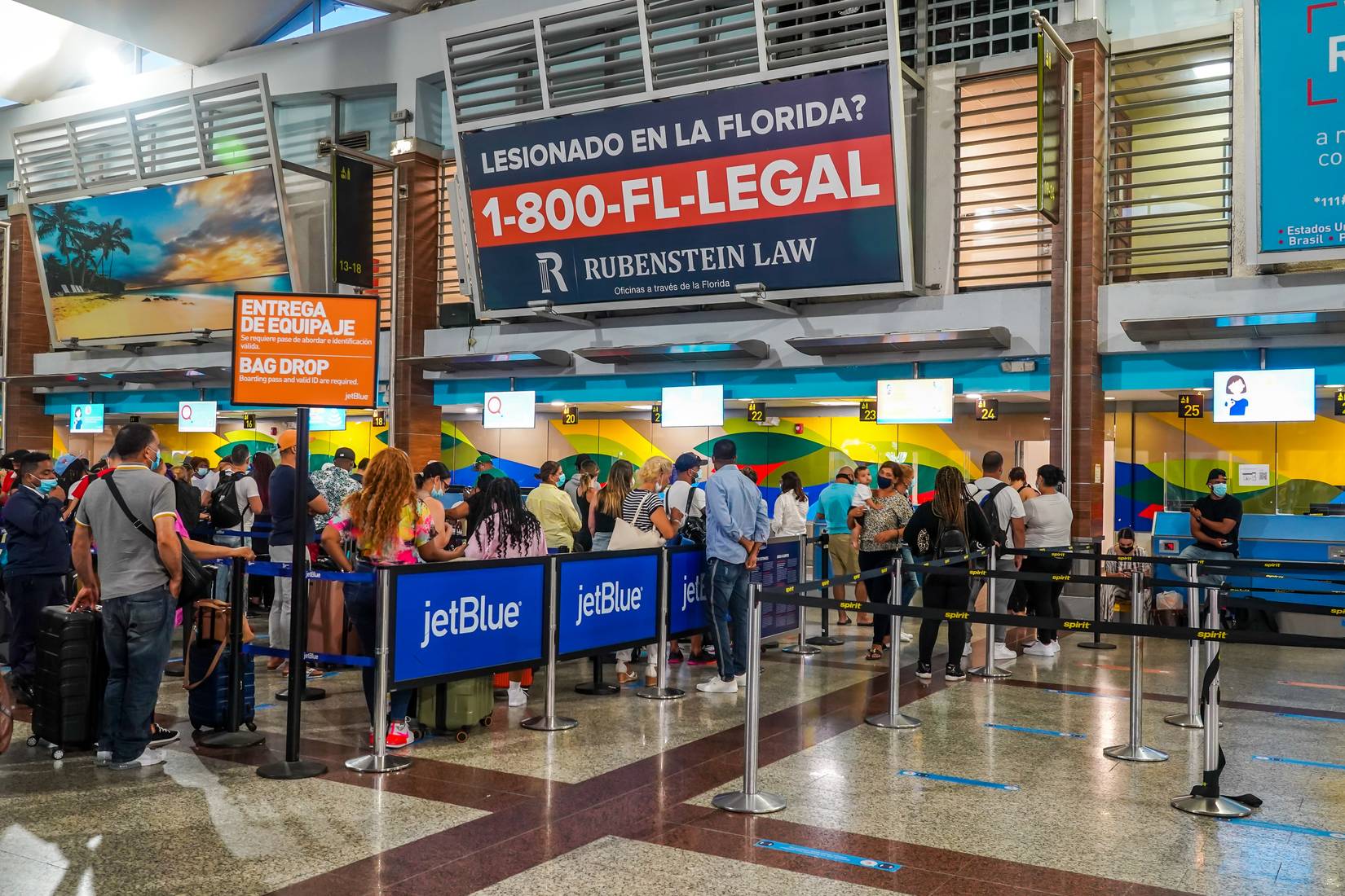 JetBlue check in counter busy for passengers.
