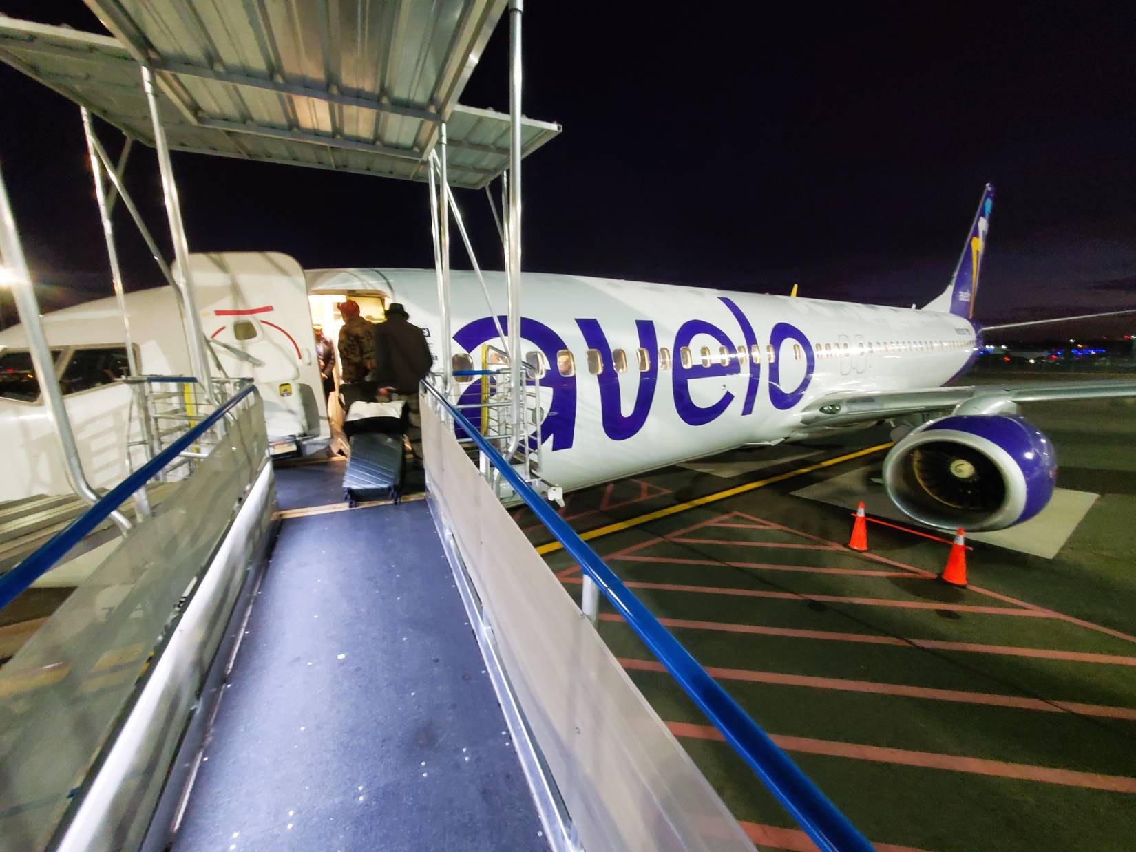 Passengers waiting in line to board Avelo Airlines flight to Lakeland, Florida