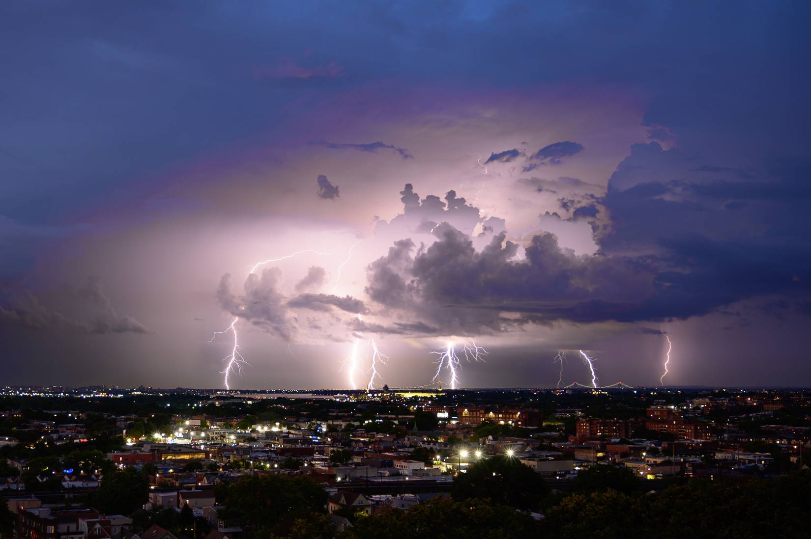 Lightning over Norther Queens - LGA airport, Whitestone Bridge and Throgsneck Bridge in view.