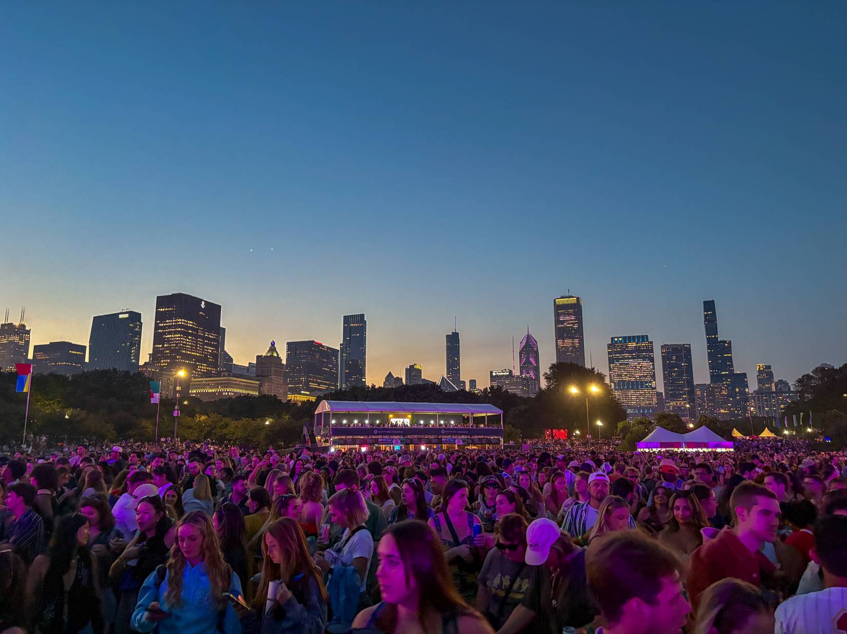 Lollapalooza at night in Chicago's Grant Park with crowd and stage