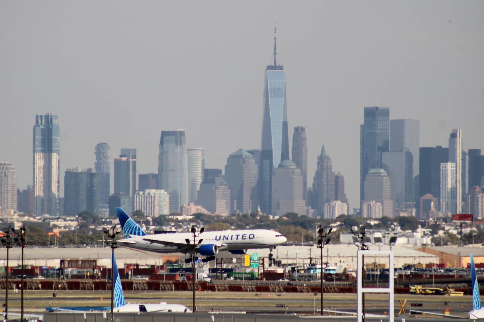 United Airlines operates at Newark International Airport (EWR) on a cloudy day