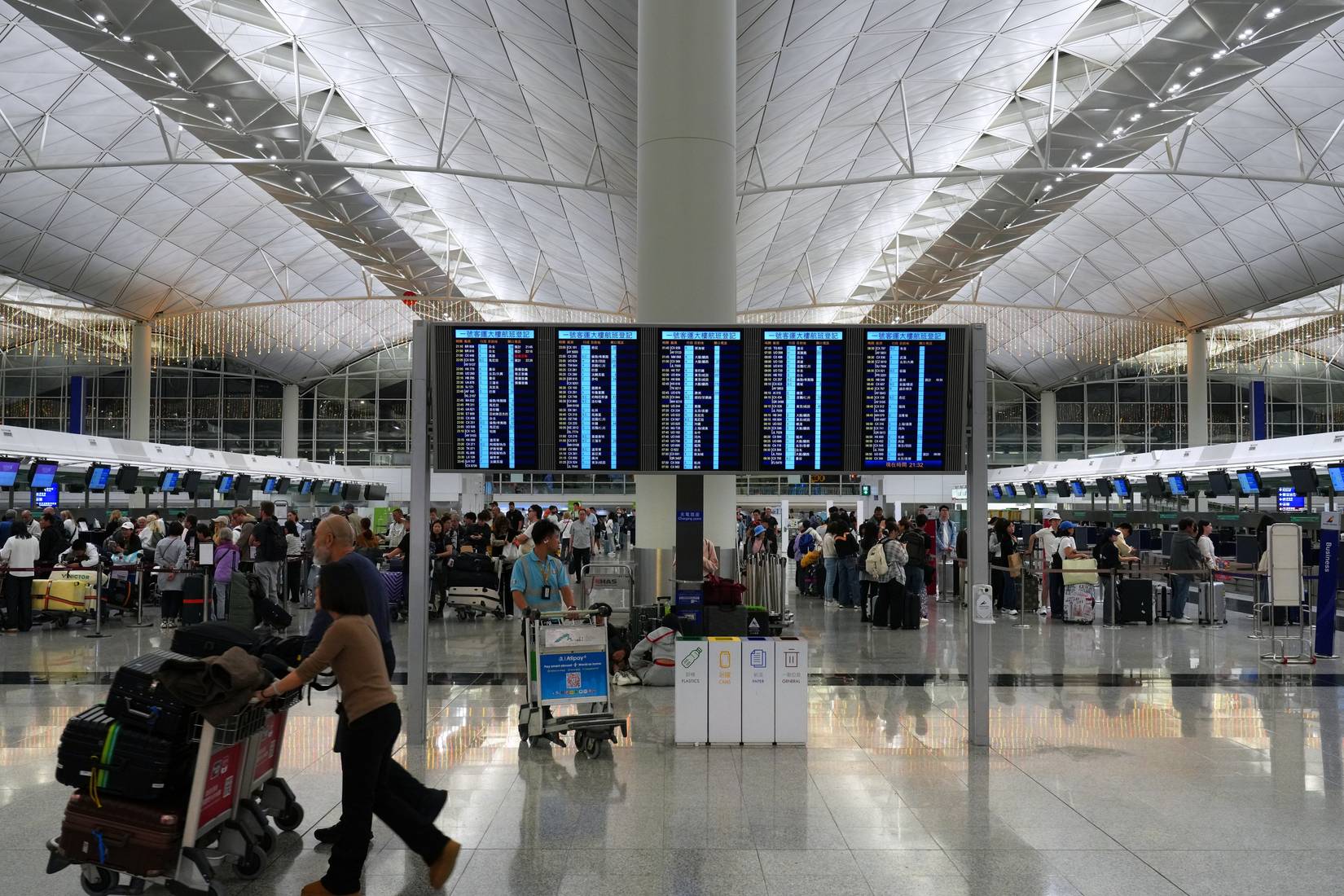 Hong Kong International Airport with passengers.