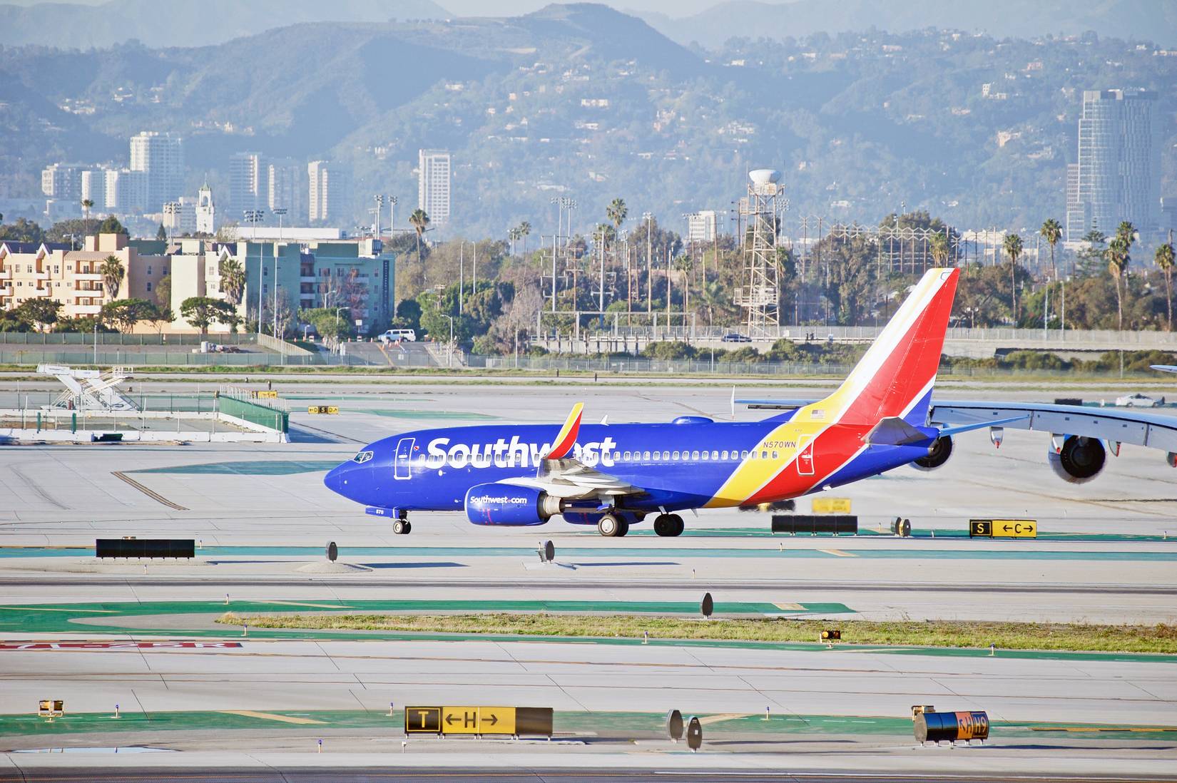 Southwest Airlines Boeing 737 aircraft taxiing along the runway at Los Angeles International Airport, Los Angeles California USA