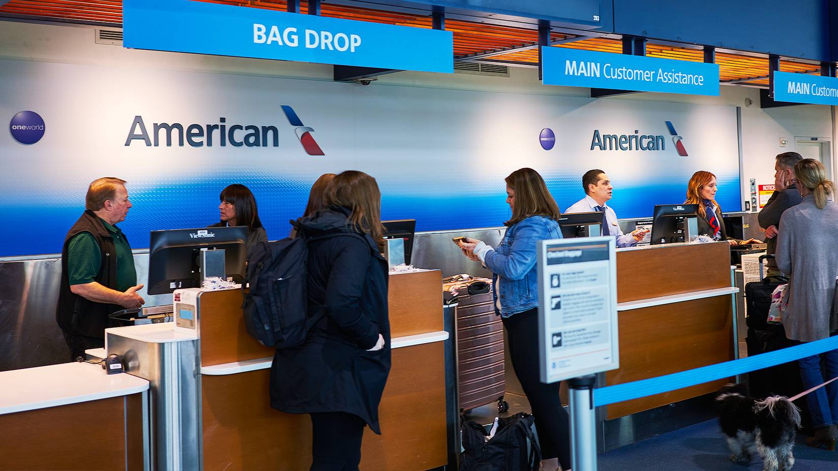 Travelers at an American Airlines desk at a U.S. airport