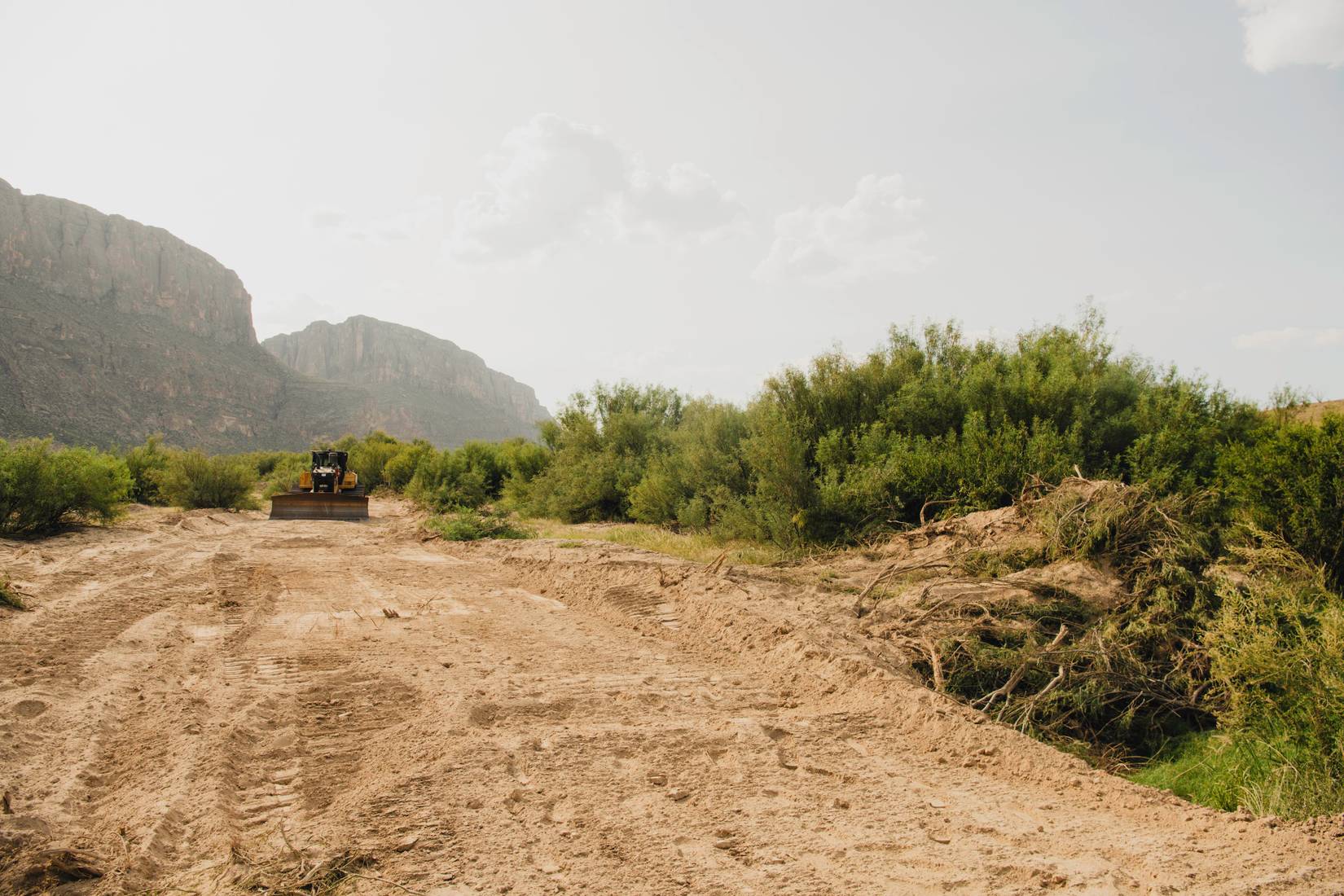 Bulldozer at Santa Elena Canyon clearing a road in Big Bend National Park for new border infrastructure - August 5, 2026