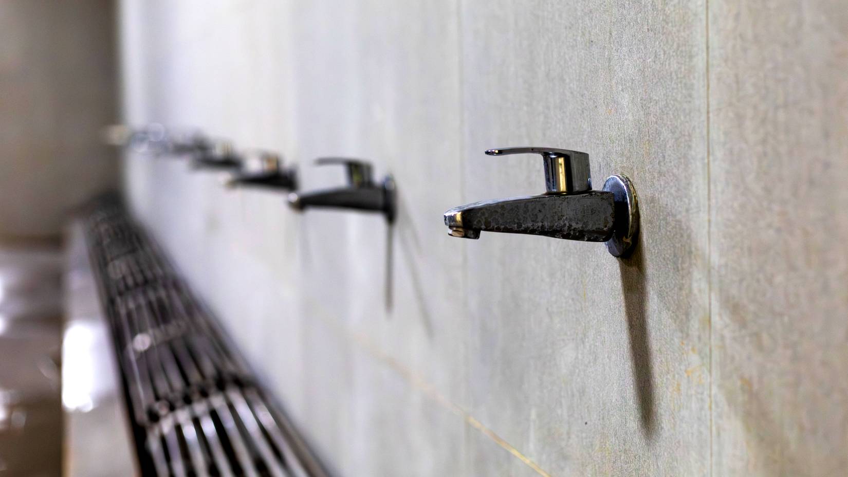 Close-ups of taps at Wudu ablution stations typically found in mosques and certain public spaces