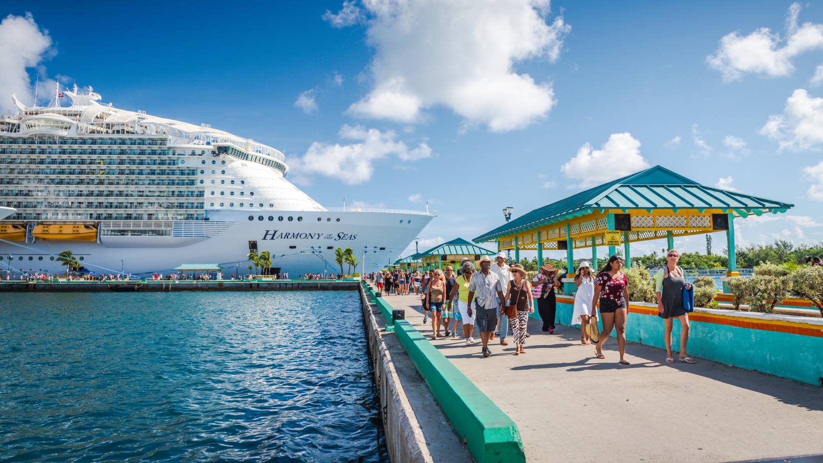 Tourists disembarking from Royal Caribbean's Harmony of the Seas cruise ship docked in Nassau Cruise Port in the Bahamas
