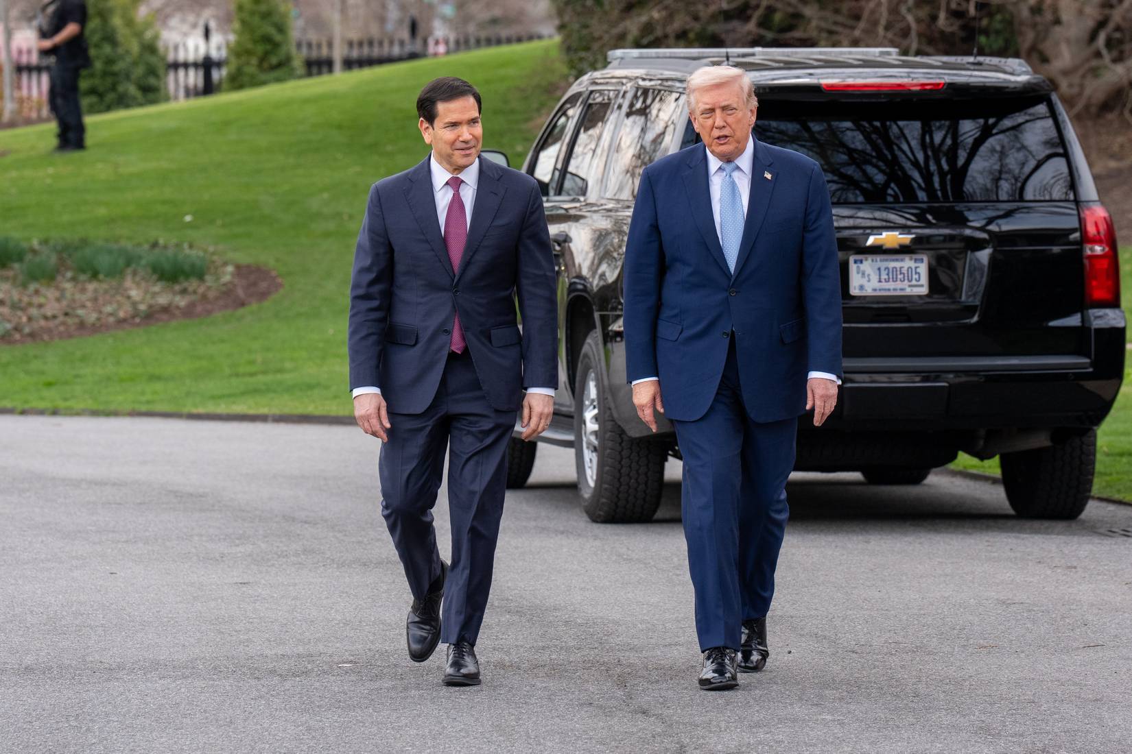 President Donald Trump and Secretary of State speak with the press as they leave the Oval Office and board Marine One to leave the White House.