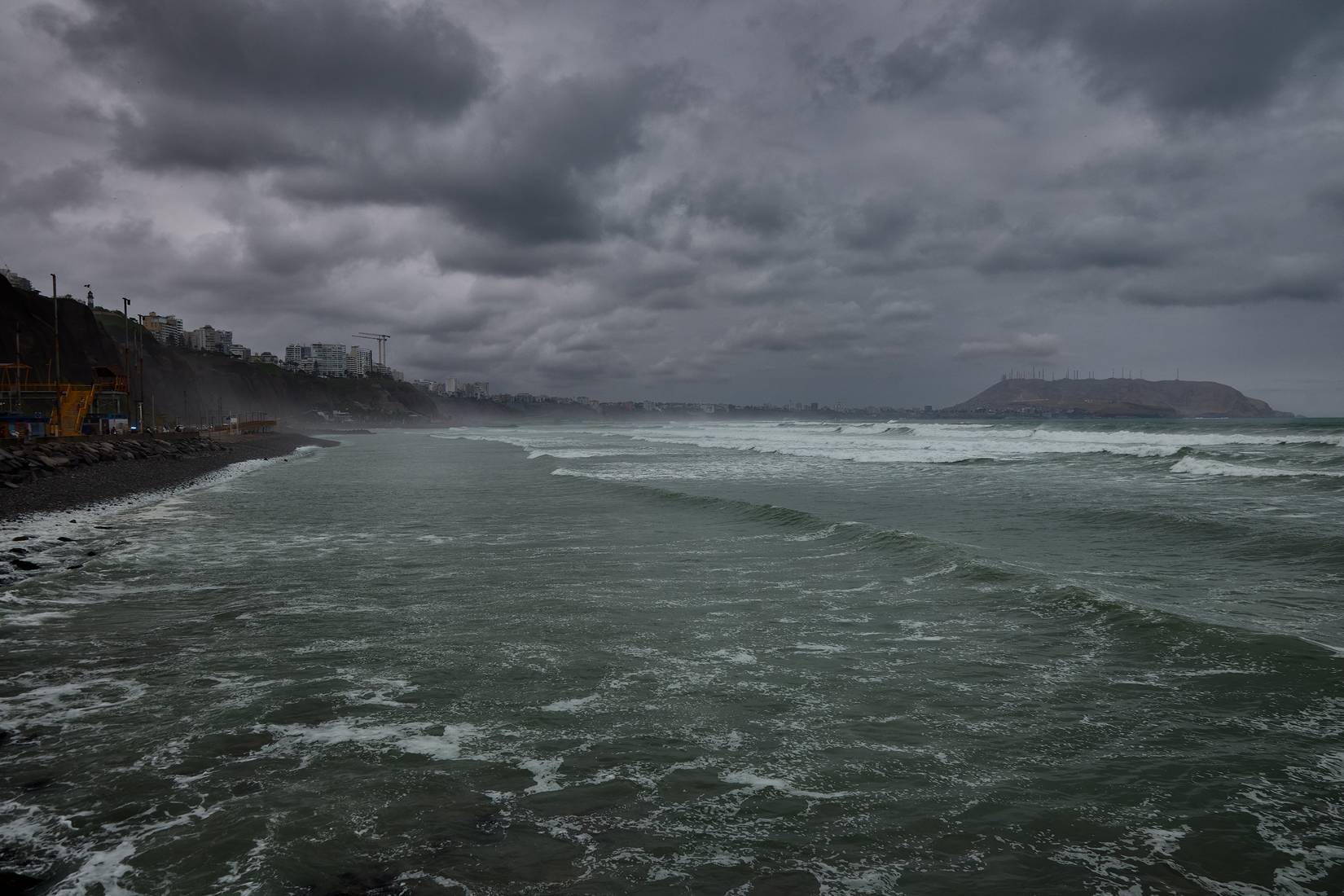 Ocean waves during a dark storm on a beach