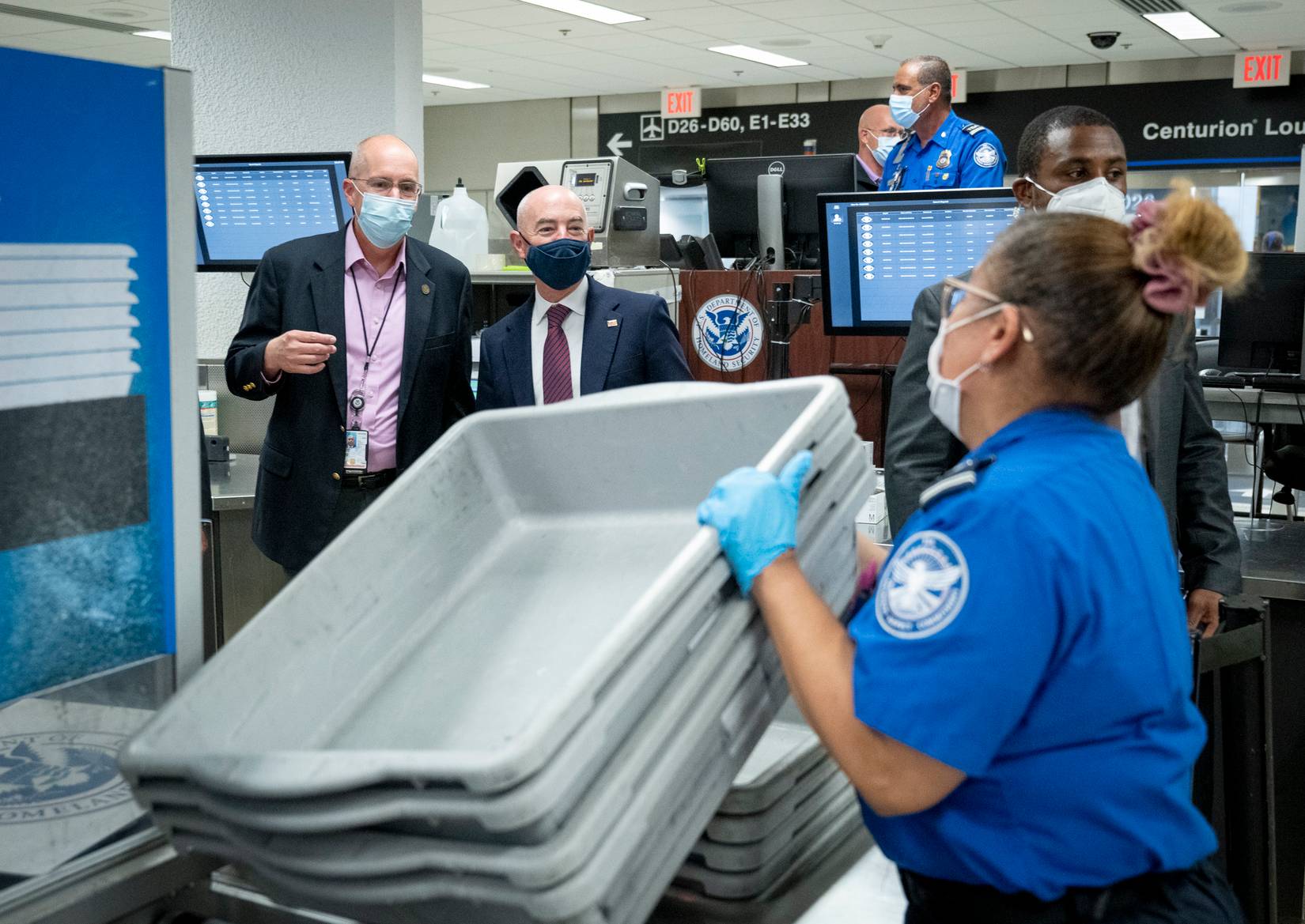 Transportation Security Administration (TSA) officer working at a checkpoint at a U.S. airport