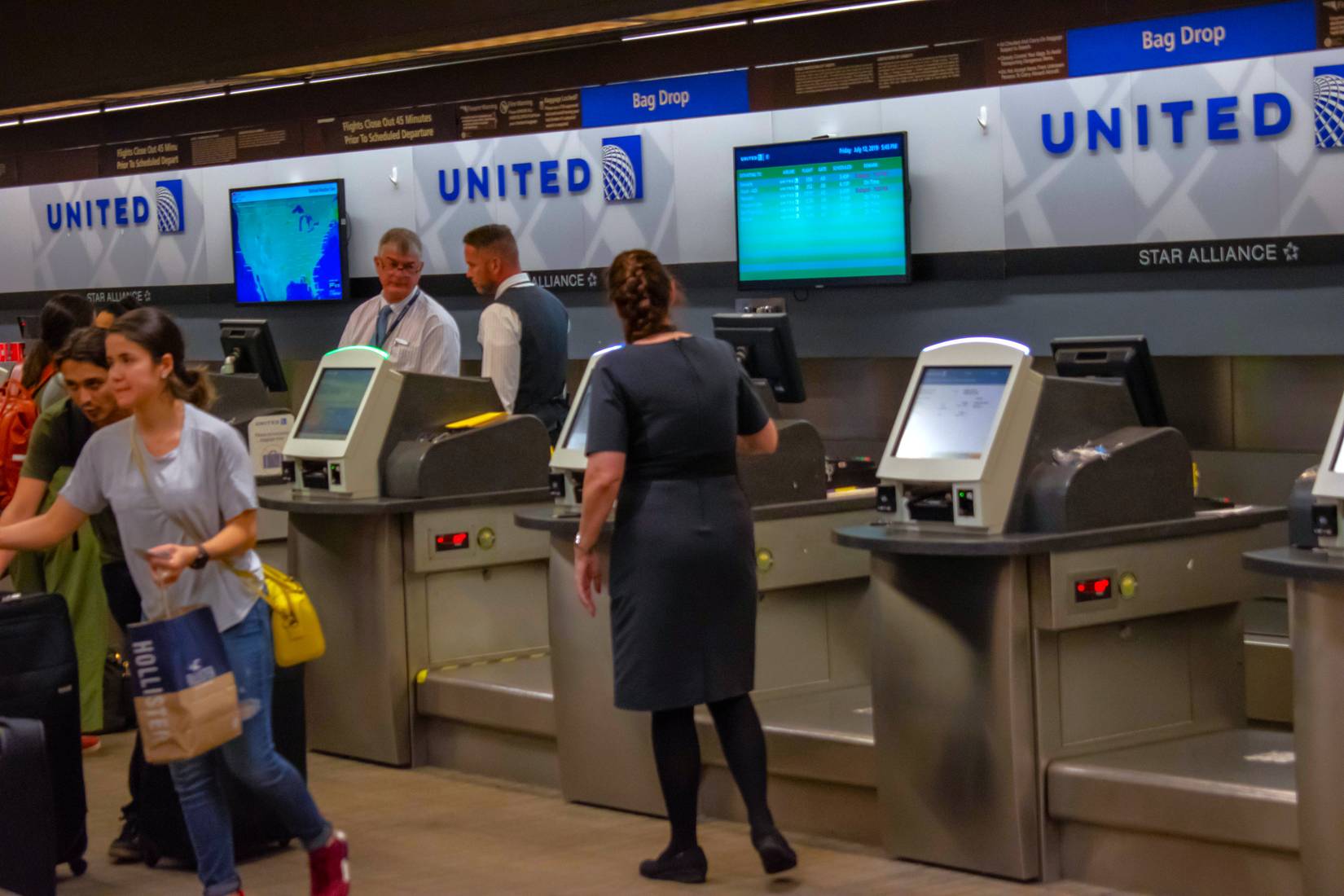 United Airlines passengers use the self-check-in counter at Tampa International Airport, Florida, USA.