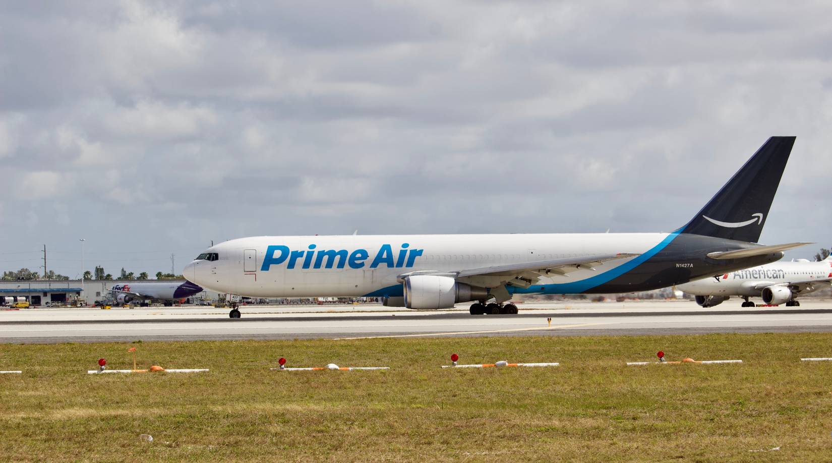 Amazon Prime Air cargo aircraft N1427A on the runway at Miami International Airport (MIA) in Miami, Florida