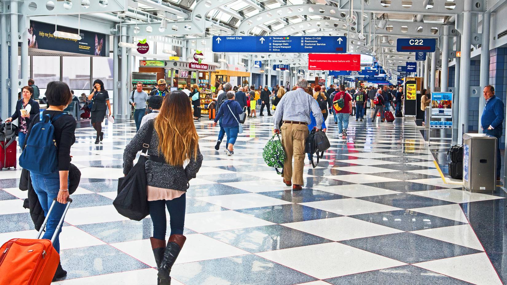 Passengers and staff throng the concourses of Chicago O'Hare International Airport (ORD)