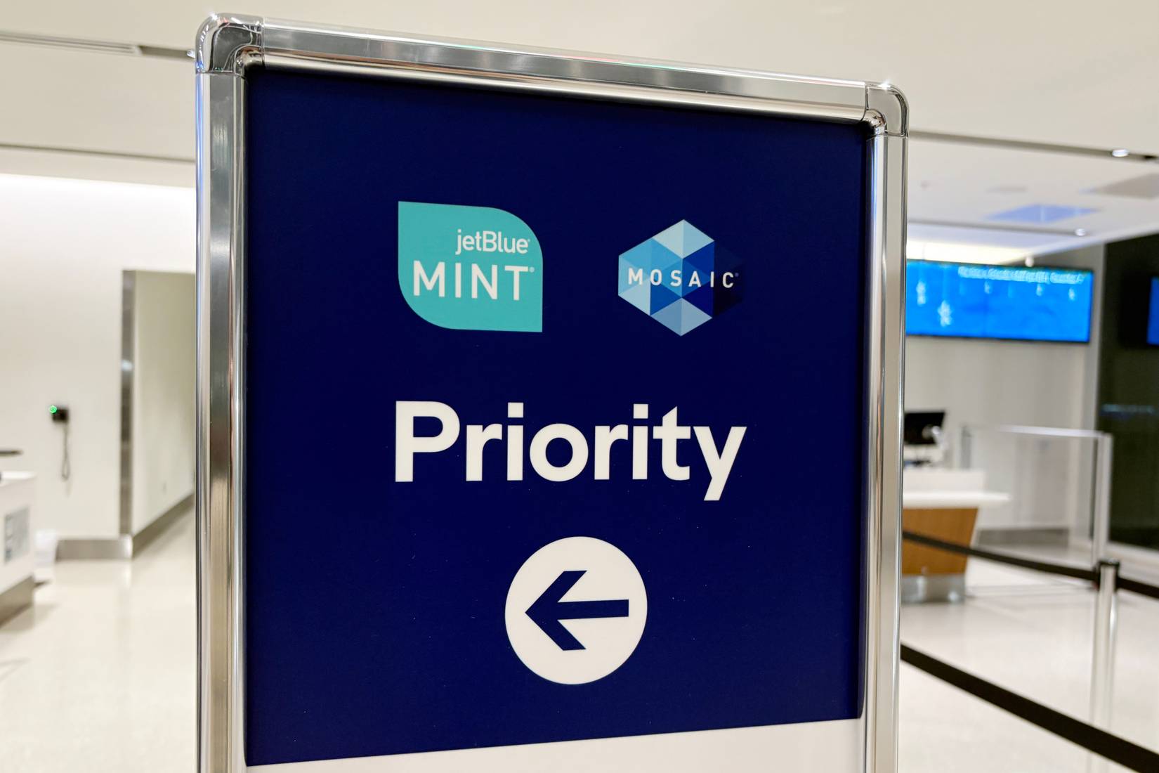 A sign for Jet Blue Airlines Mint and Mosiac Priority boarding for their frequent flyers