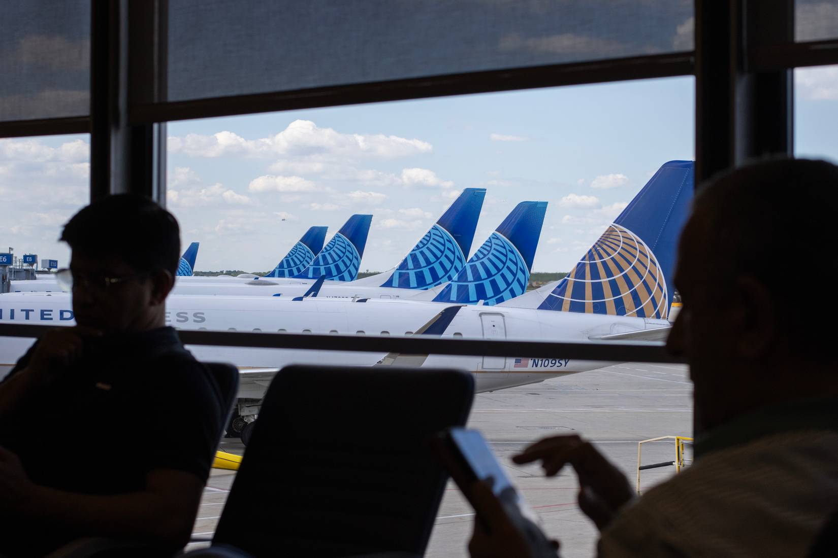 Passengers waiting at the terminal gates for United Airlines flights at Chicago O'Hare International Airport (ORD).