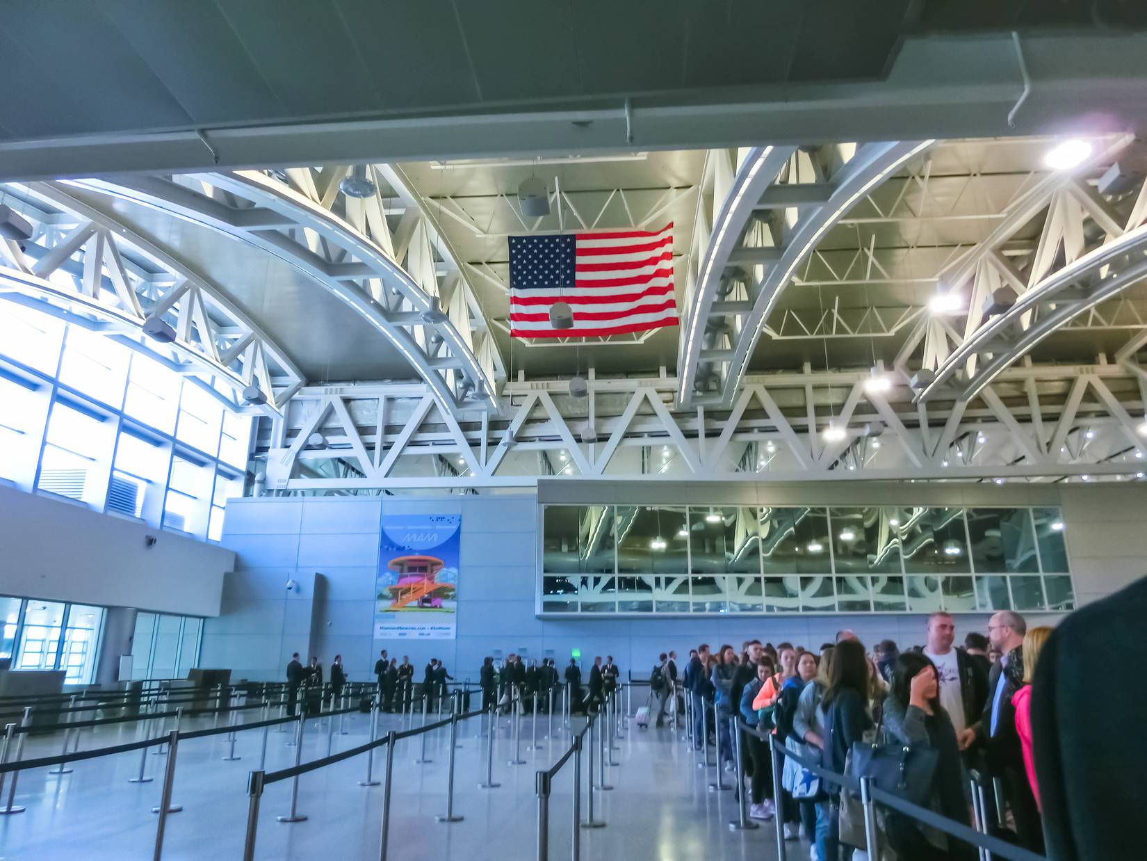 Travelers in a queue inside Miami International Airport (MIA), Miami, Florida, USA